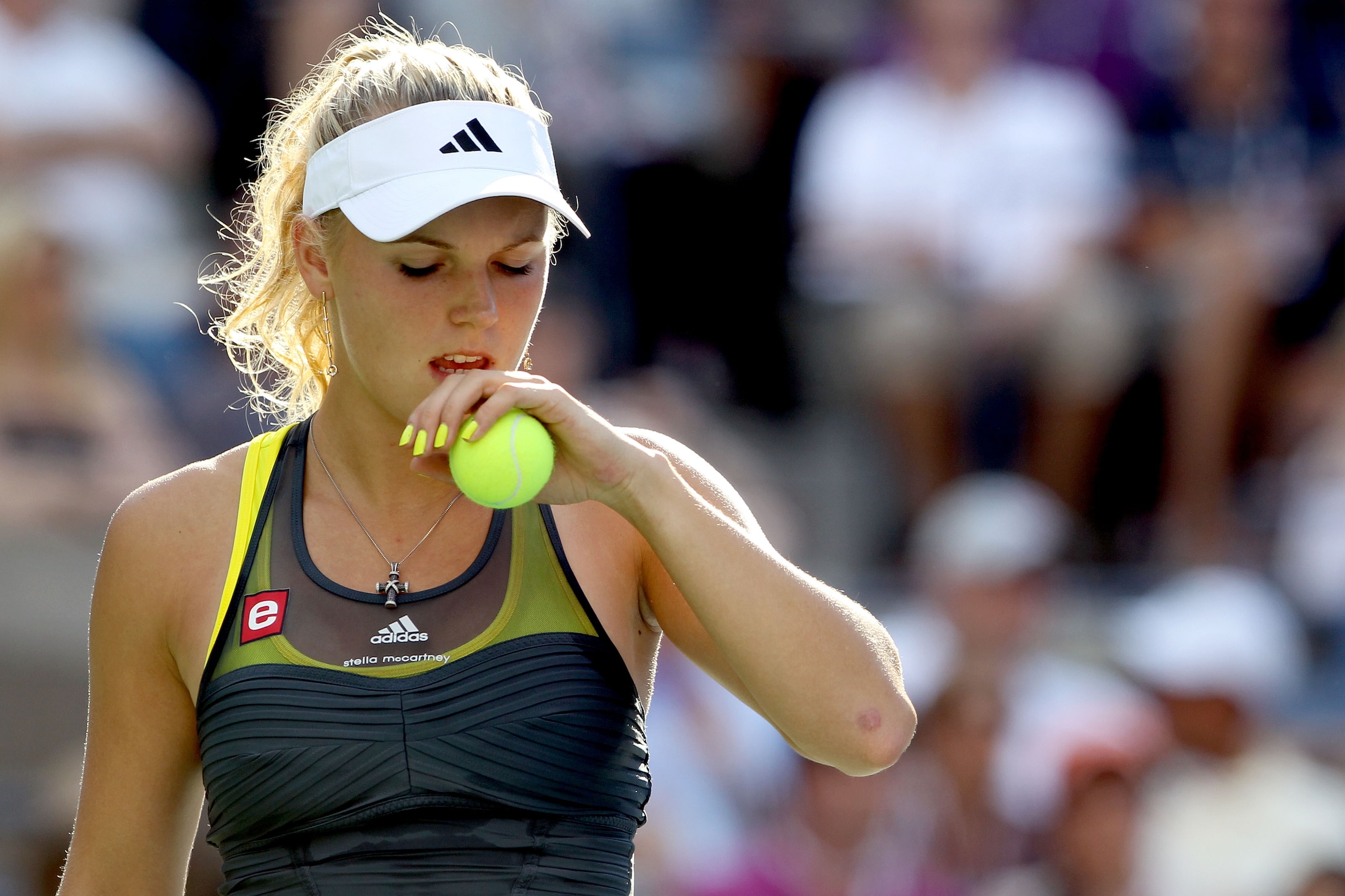 NEW YORK - SEPTEMBER 06:  Caroline Wozniacki of Denmark readies herself to serve against Maria Sharapova of Russia during the women's singles match on day eight of the 2010 U.S. Open at the USTA Billie Jean King National Tennis Center on September 6, 2010