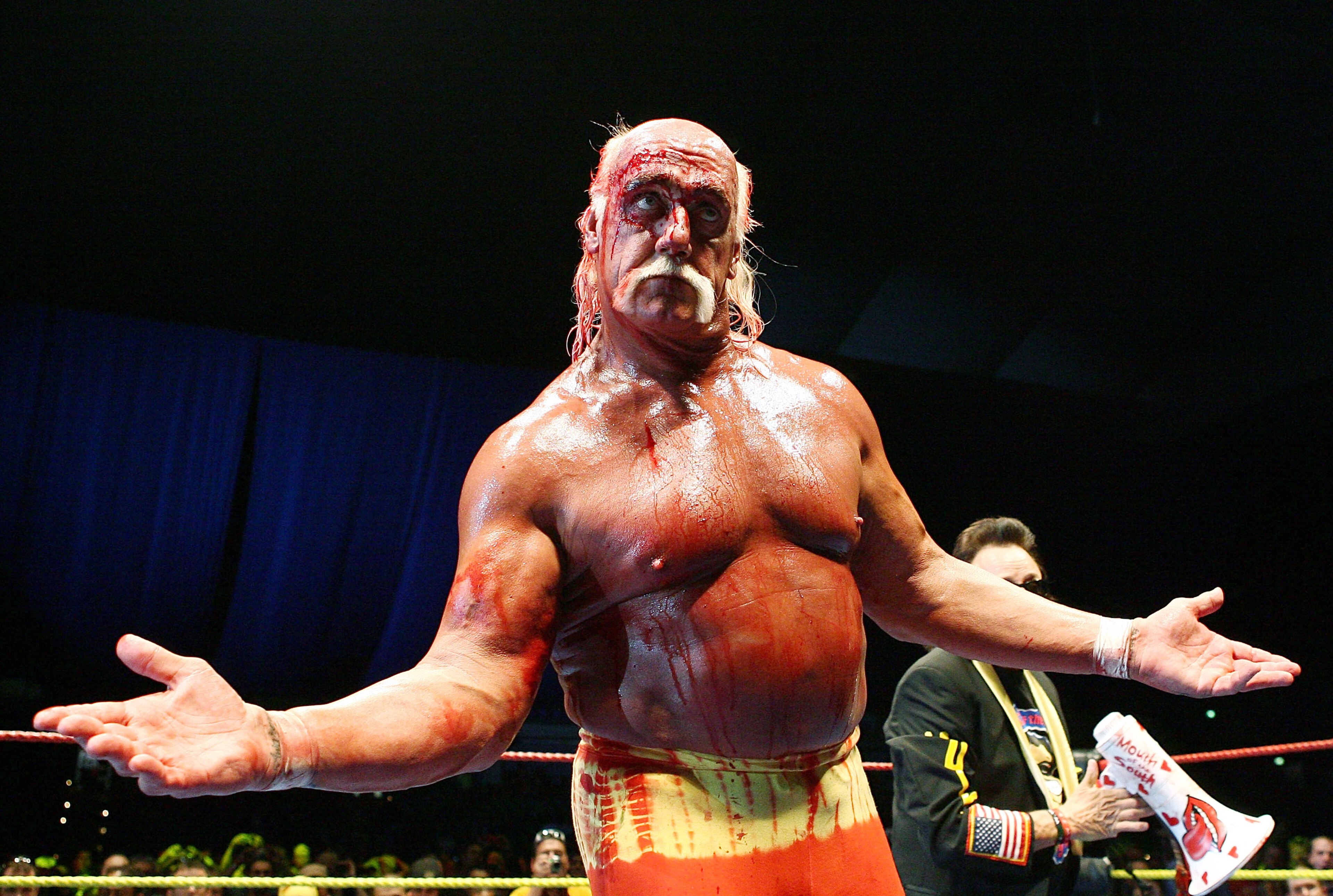PERTH, AUSTRALIA - NOVEMBER 24:  Hulk Hogan gestures to the audience during his Hulkamania Tour at the Burswood Dome on November 24, 2009 in Perth, Australia.  (Photo by Paul Kane/Getty Images)