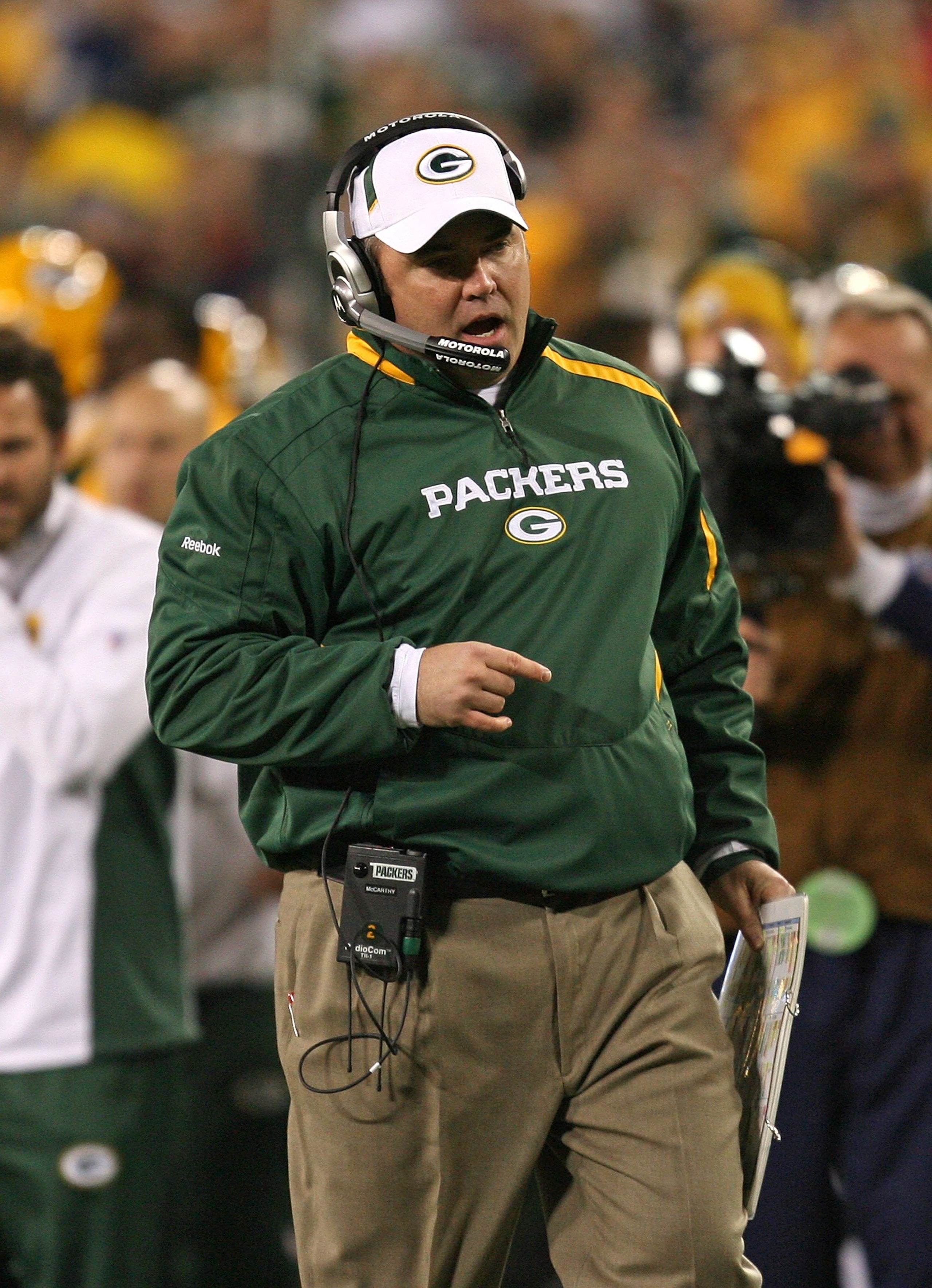 GREEN BAY, WI - NOVEMBER 15: Head coach Mike McCarthy of the Green Bay Packers talks to an official during a game against the Dallas Cowboys at Lambeau Field on November 15, 2009 in Green Bay, Wisconsin. The Packers defeated the Cowboys 17-7. (Photo by Jo
