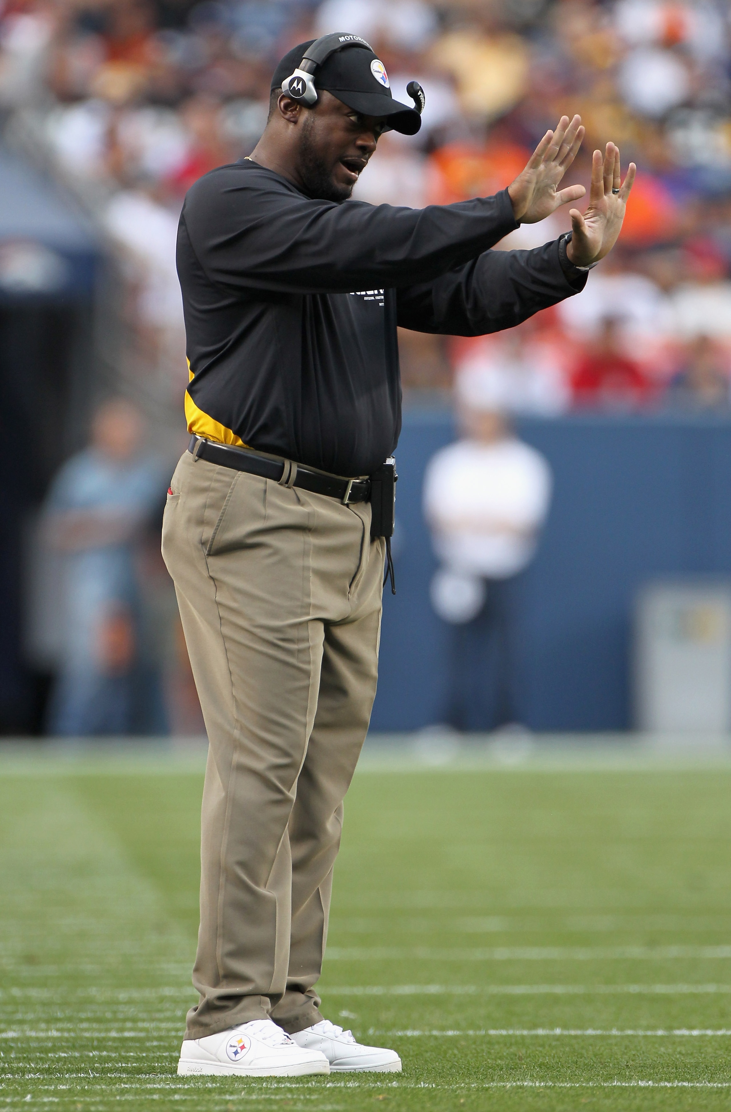 DENVER - AUGUST 29:  Head coach Mike Tomlin of the Pittsburgh Steelers leads his team against the Denver Broncos during preseason NFL action at INVESCO Field at Mile High on August 29, 2010 in Denver, Colorado. The Broncos defeated the Steelers 34-17.  (P