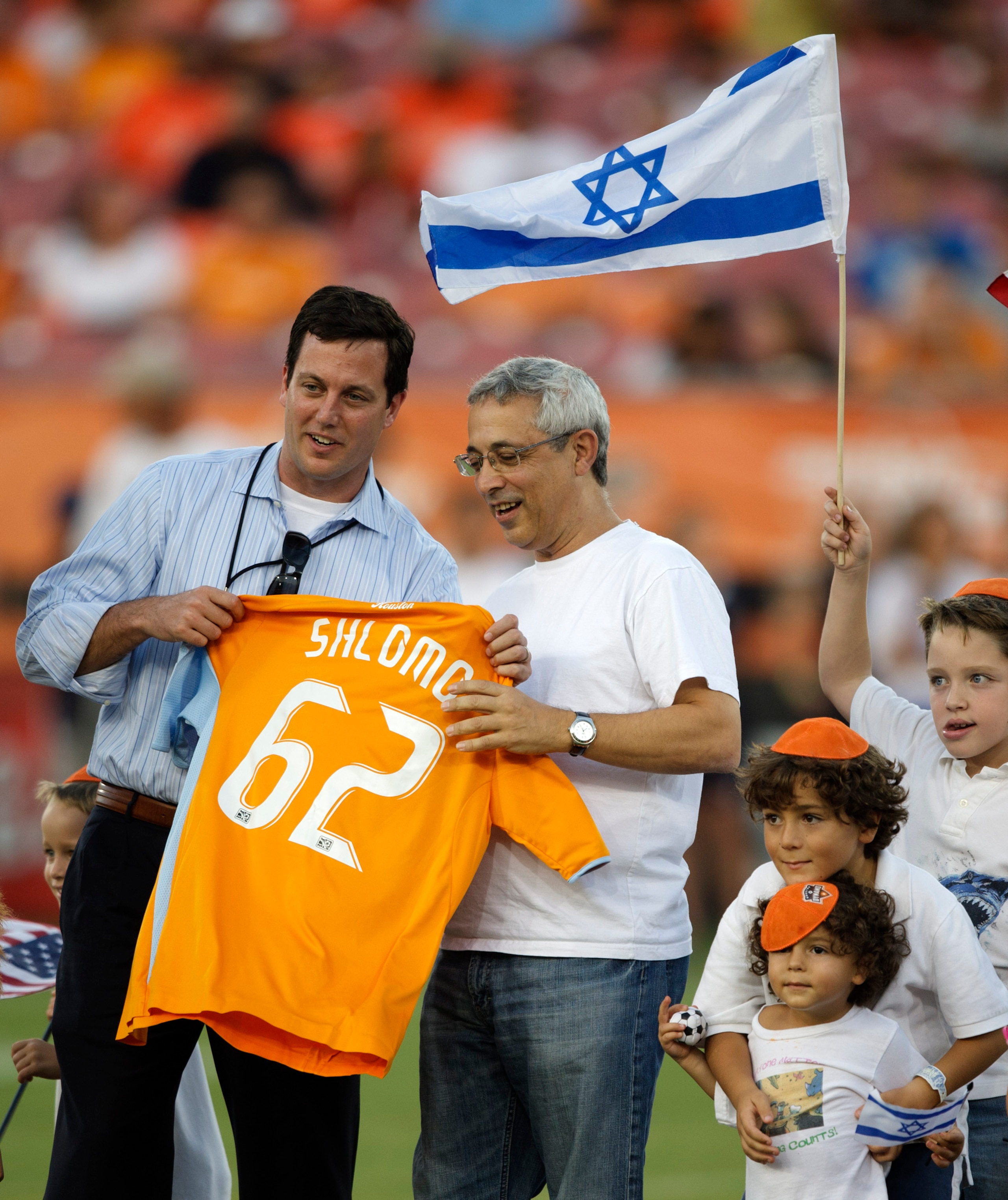 HOUSTON - SEPTEMBER 05:  Houston Dynamo COO Chris Canetti (L) presents Consul General of Israel Meir Shlomo a Houston Dynamo Jersey on Jewish Community Night at Robertson Stadium  on September 5, 2010 in Houston, Texas.  (Photo by Bob Levey/Getty Images)