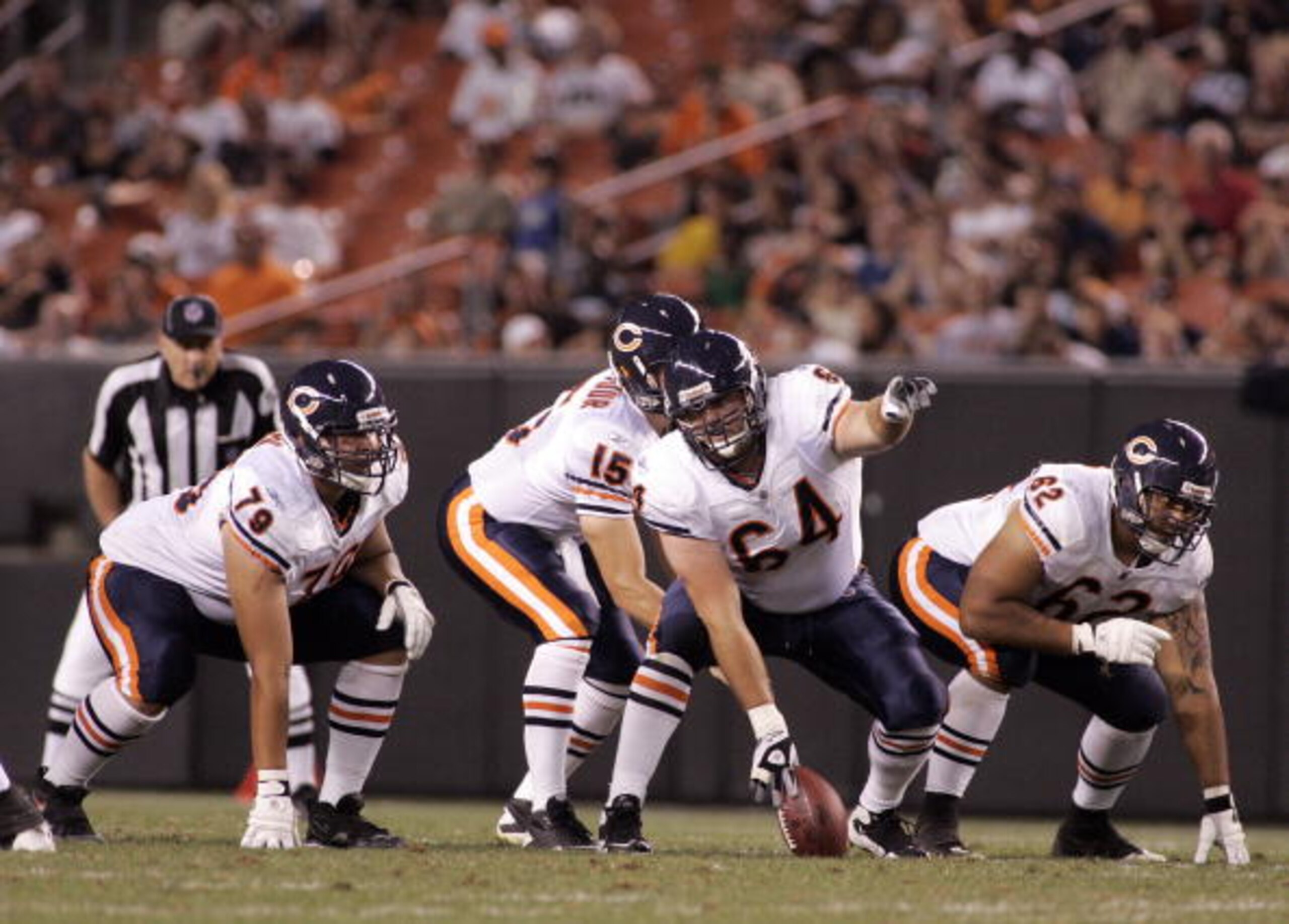 CLEVELAND - SEPTEMBER 2: Tim Walter #64 (C) makes a call to Levi Horn #79 (L) and Johan Asiata #62 (R) of the Chicago Bears against the Cleveland Browns during the preseason game on September 2, 2010 at Cleveland Browns Stadium in Cleveland, Ohio. The Bro