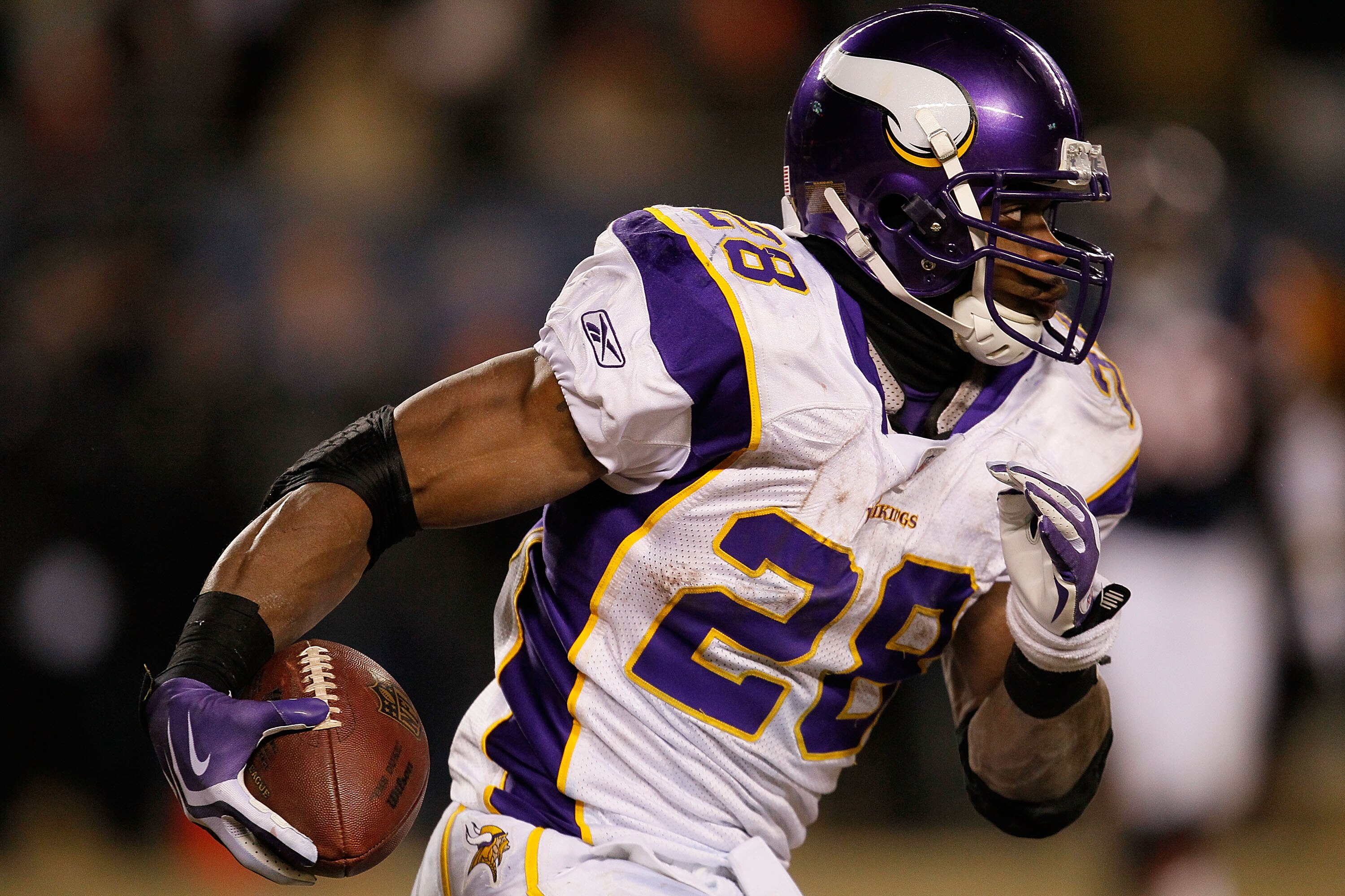 CHICAGO - DECEMBER 28: Adrian Peterson #28 of the Minnesota Vikings runs against the Chicago Bears at Soldier Field on December 28, 2009 in Chicago, Illinois. The Bears defeated the Vikings 36-30 in overtime.  (Photo by Jonathan Daniel/Getty Images)