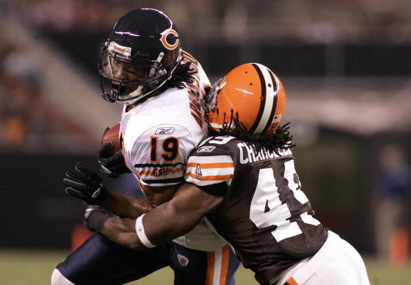 CLEVELAND - SEPTEMBER 2:  Devin Aromashodu #19 of the Chicago Bears makes a catch and is tackled by Chris Chancellor #49 of the Cleveland Browns during the preseason game on September 2, 2010 at Cleveland Browns Stadium in Cleveland, Ohio. (Photo by Justi