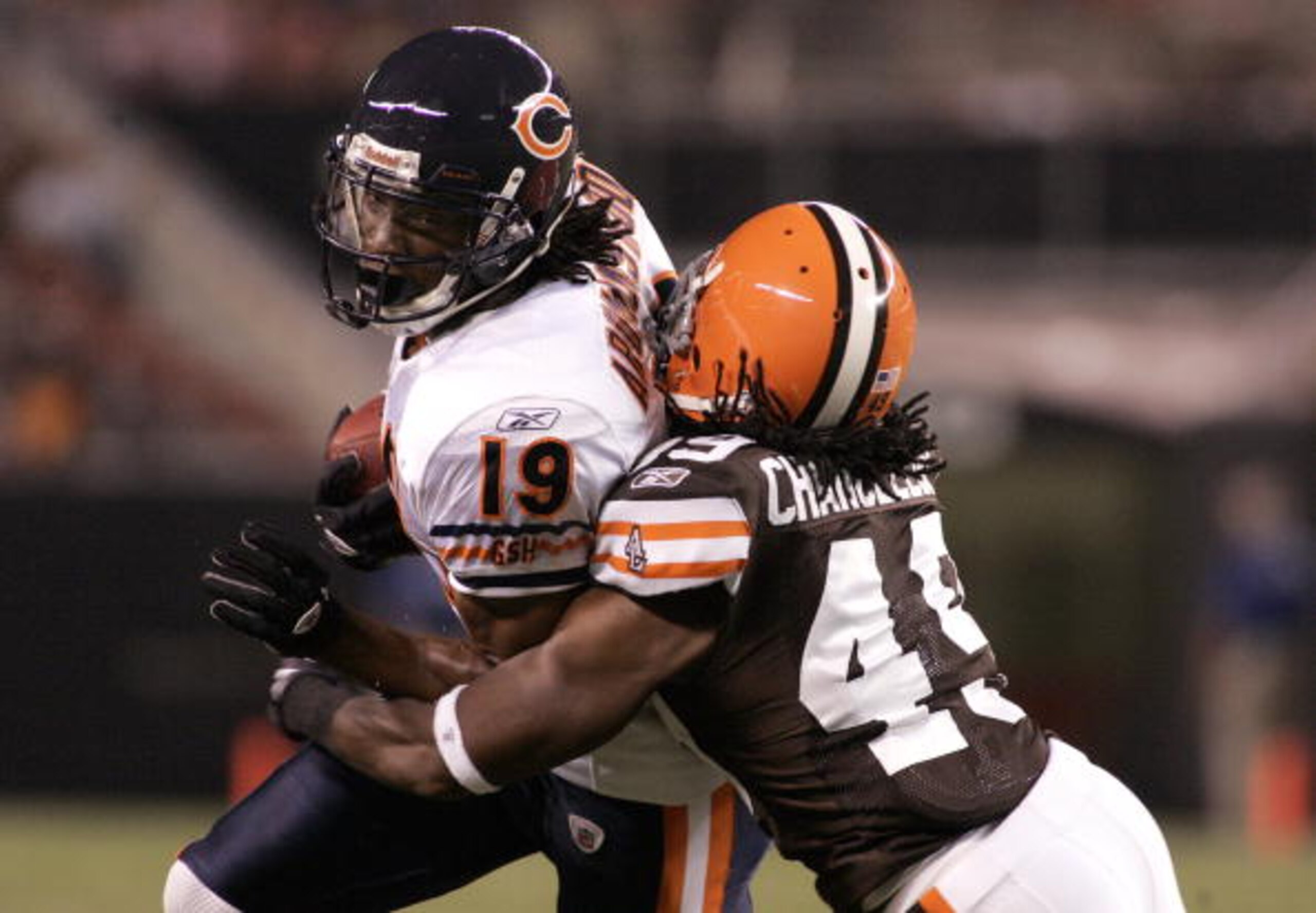 CLEVELAND - SEPTEMBER 2:  Devin Aromashodu #19 of the Chicago Bears makes a catch and is tackled by Chris Chancellor #49 of the Cleveland Browns during the preseason game on September 2, 2010 at Cleveland Browns Stadium in Cleveland, Ohio. (Photo by Justi