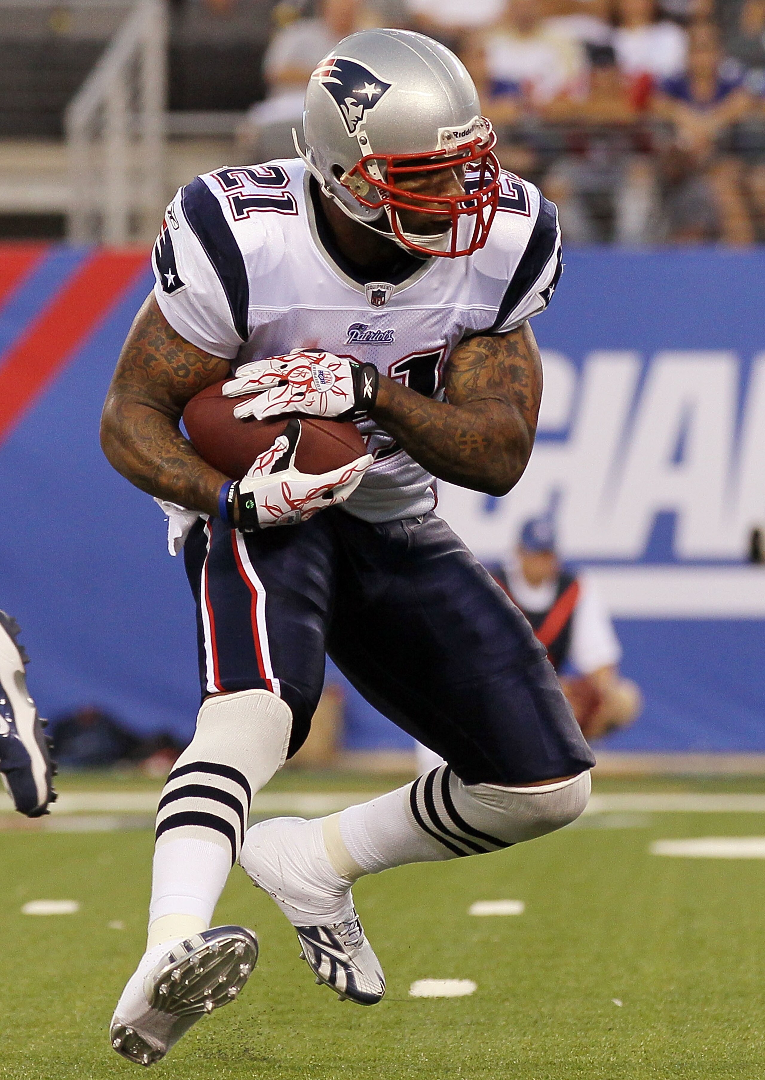 EAST RUTHERFORD, NJ - SEPTEMBER 02:  Fred Taylor #21 of the New England Patriots runs the ball against the New York Giants on September 2, 2010 at the New Meadowlands Stadium in East Rutherford, New Jersey. The Giants defeated the Patriots 20-17.  (Photo