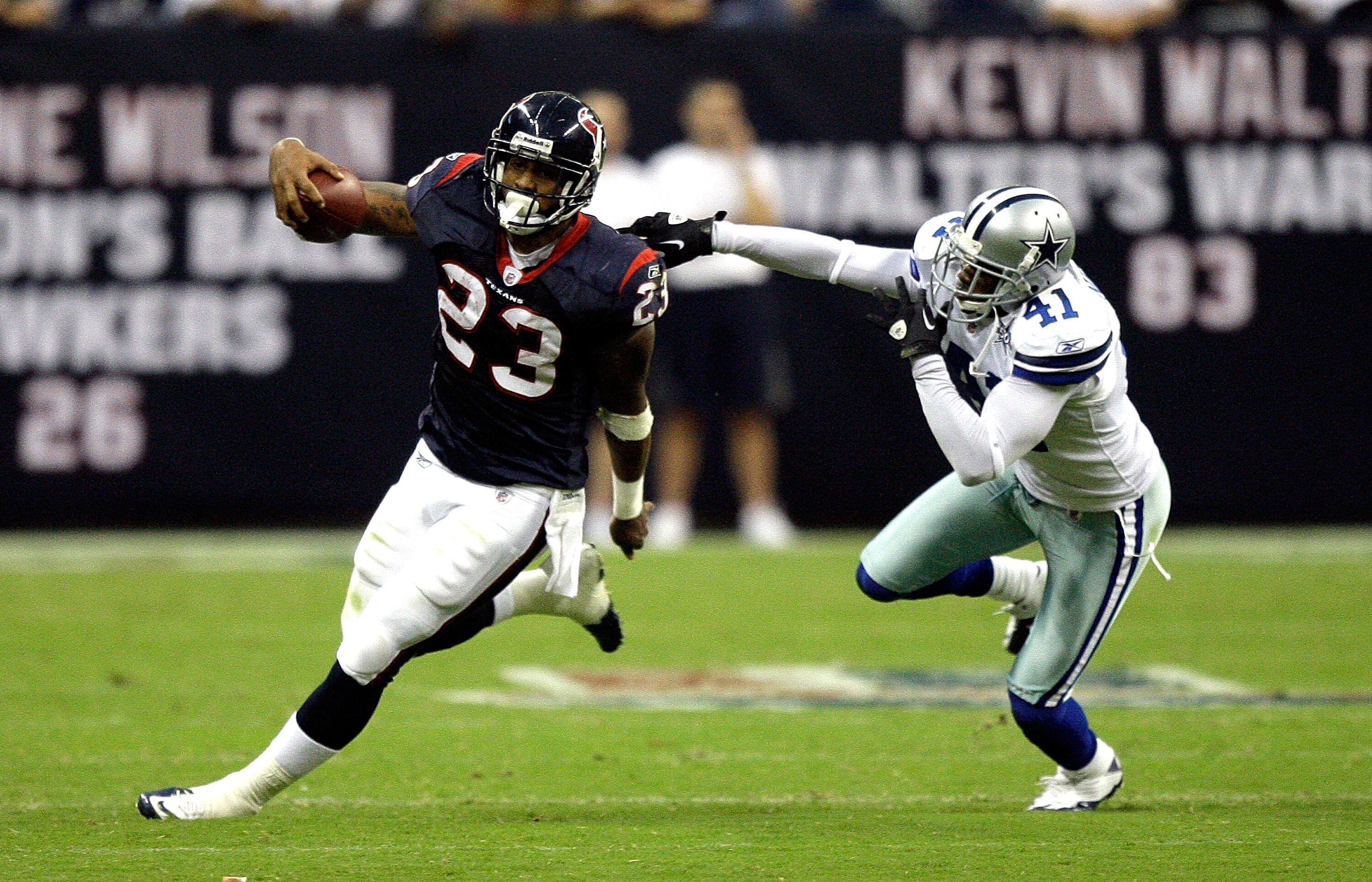HOUSTON - AUGUST 28:  Running back Arian Foster #23 of the Houston Texans avoids a tackle from cornerback Terrence Newman #41 of the Dallas Cowboys in the first quarter of a preseason game at Reliant Stadium on August 28, 2010 in Houston, Texas.  (Photo b