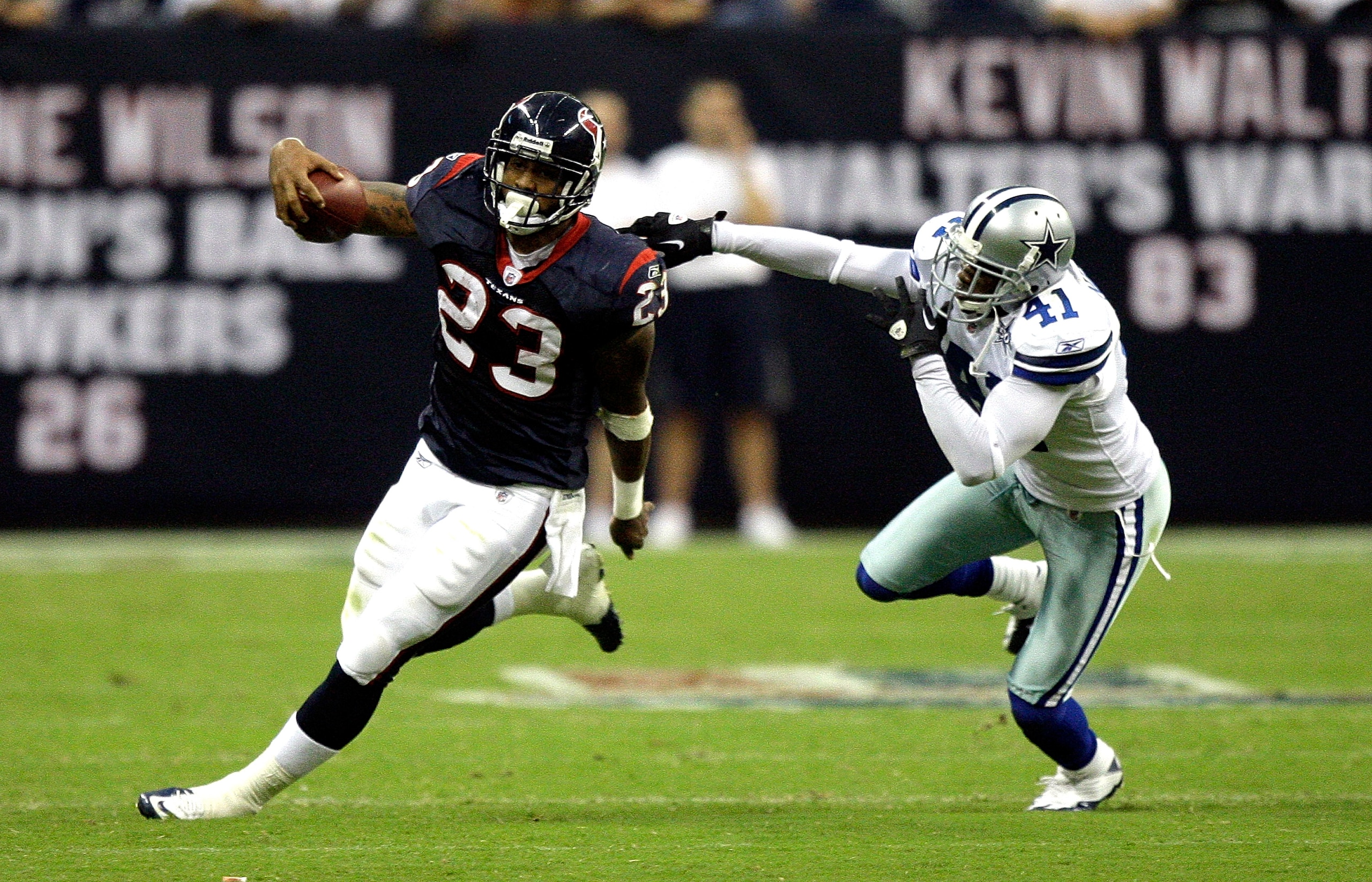 HOUSTON - AUGUST 28:  Running back Arian Foster #23 of the Houston Texans avoids a tackle from cornerback Terrence Newman #41 of the Dallas Cowboys in the first quarter of a preseason game at Reliant Stadium on August 28, 2010 in Houston, Texas.  (Photo b