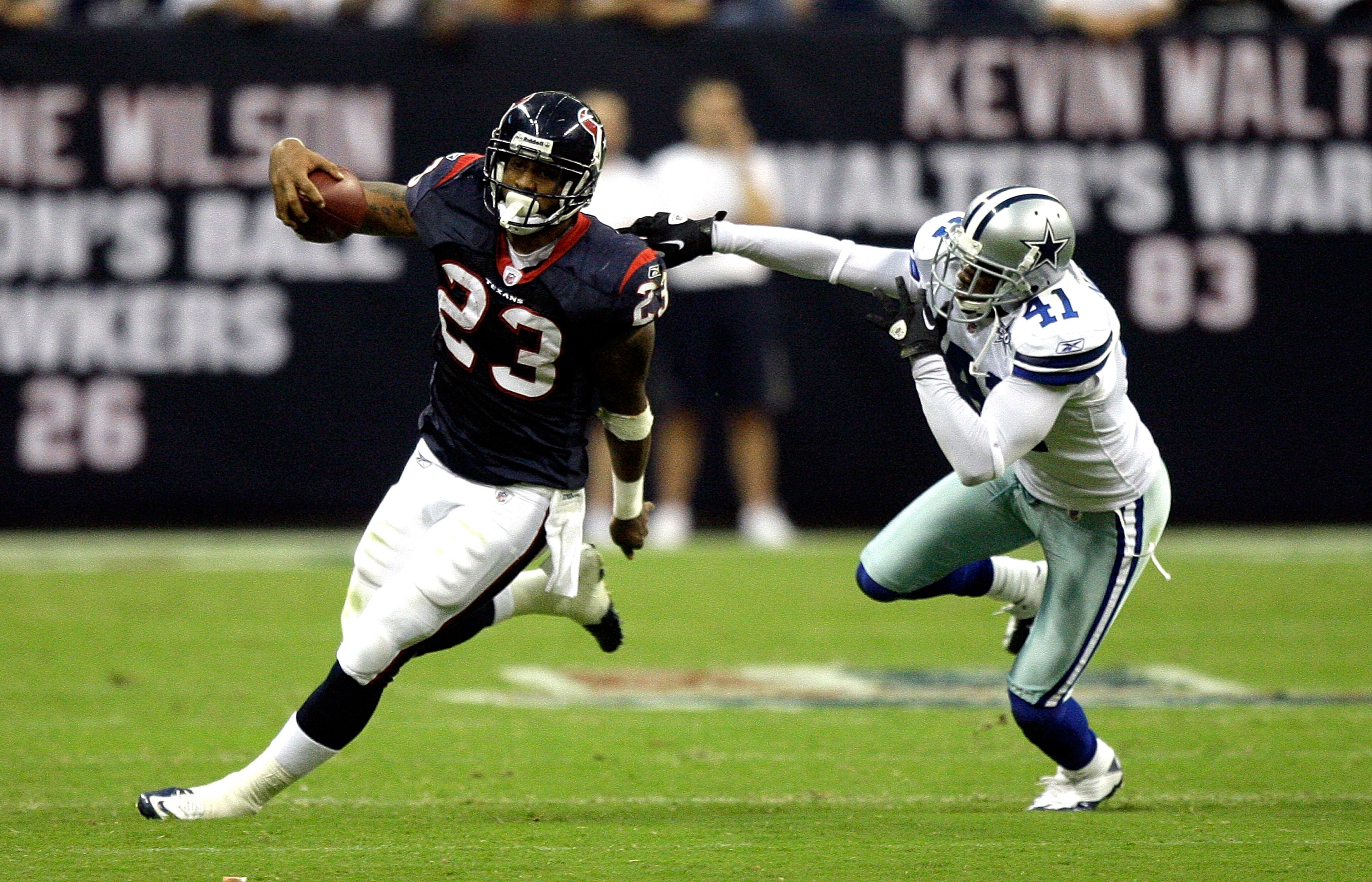 HOUSTON - AUGUST 28:  Running back Arian Foster #23 of the Houston Texans avoids a tackle from cornerback Terrence Newman #41 of the Dallas Cowboys in the first quarter of a preseason game at Reliant Stadium on August 28, 2010 in Houston, Texas.  (Photo b