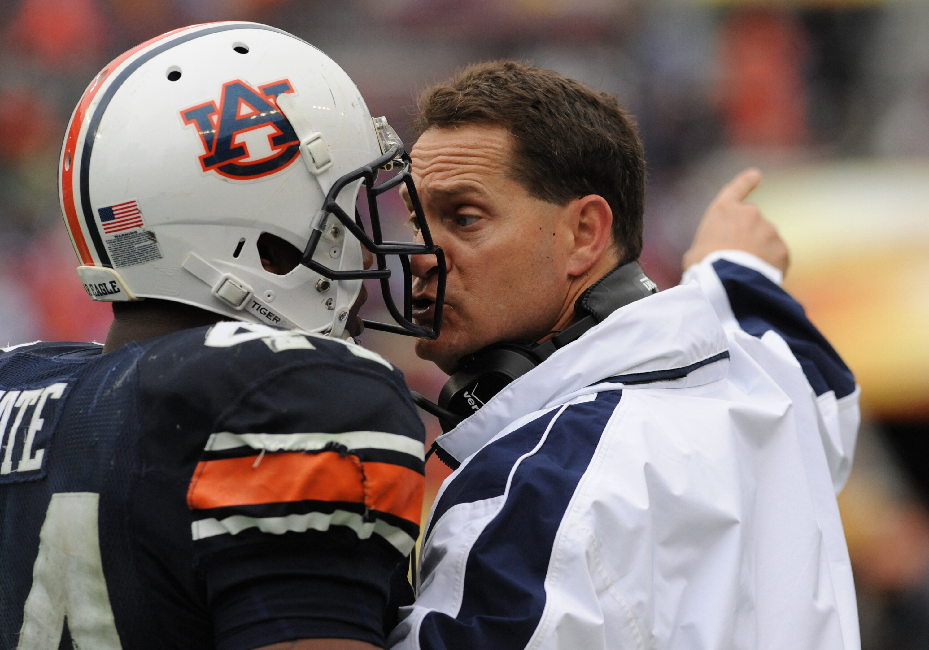 TAMPA, FL - JANUARY 1: Coach Gene Chizik of the Auburn Tigers talks with running back Ben Tate #44 after an unsportmanlike penalty against the Northwestern Wildcats in the Outback Bowl January 1, 2010 at Raymond James Stadium in Tampa, Florida.  (Photo by