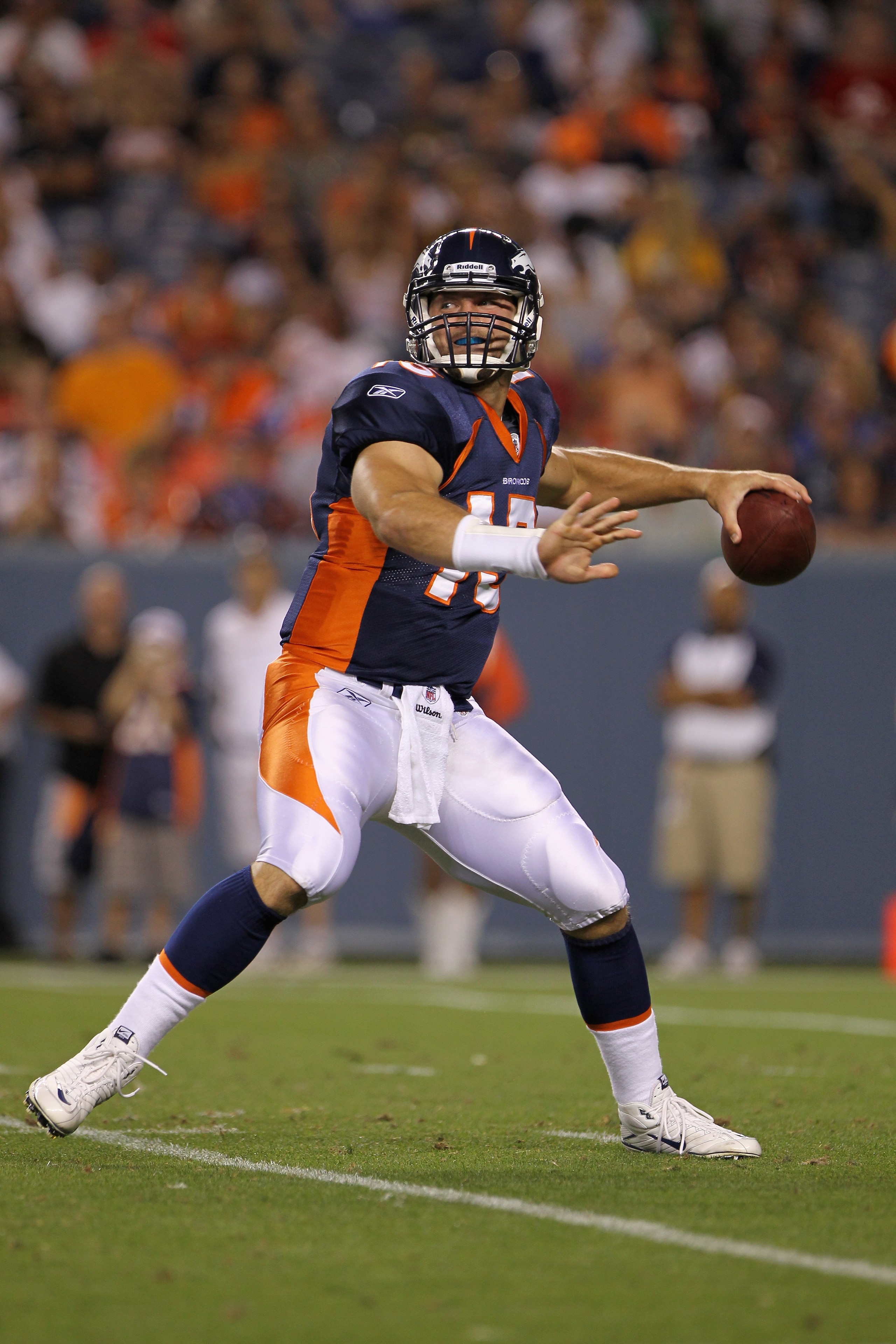 DENVER - AUGUST 29:  Quarterback Tim Tebow #15 of the Denver Broncos drops back to deliver a pass against the Pittsburgh Steelers during preseason NFL action at INVESCO Field at Mile High on August 29, 2010 in Denver, Colorado. The Broncos defeated the St