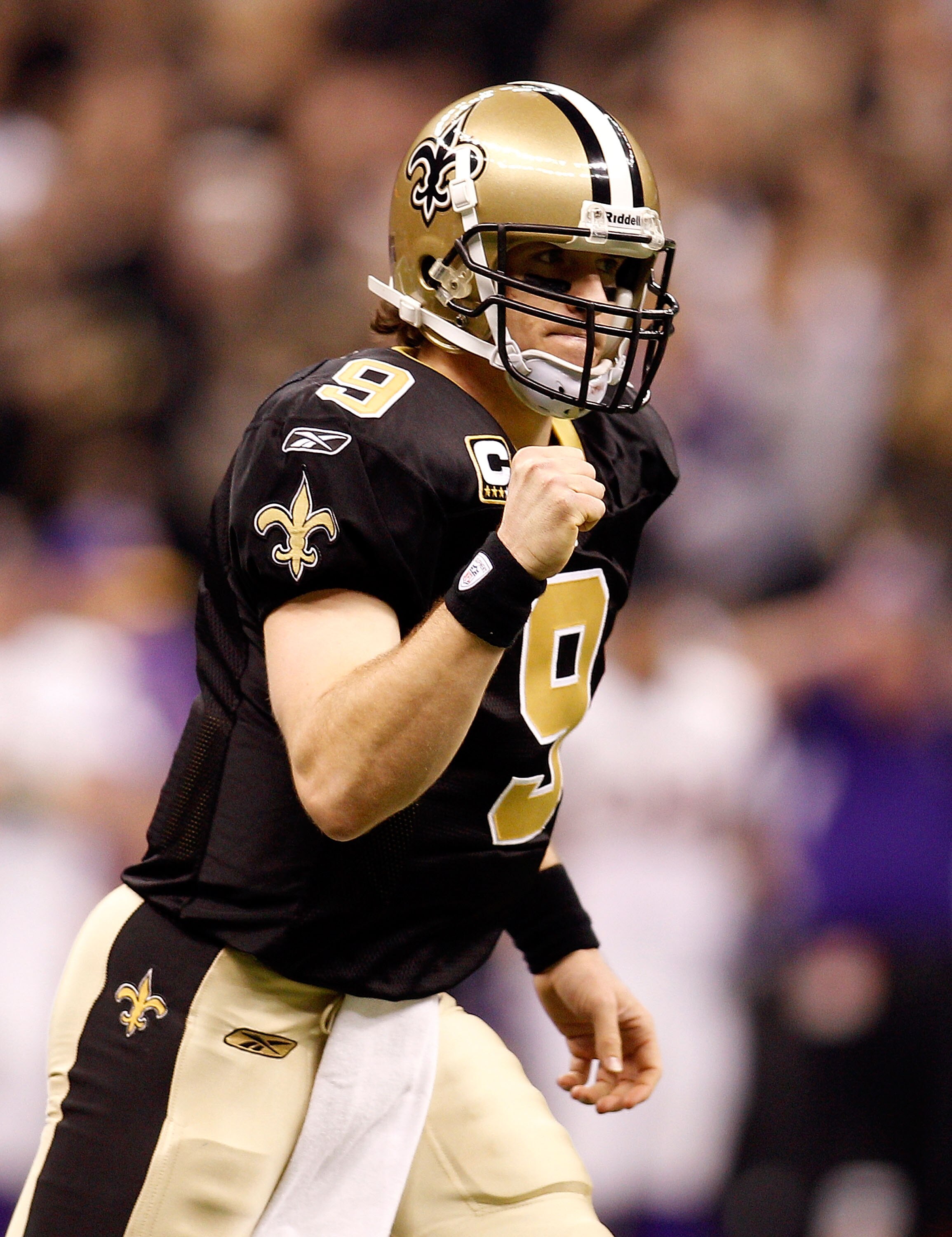 NEW ORLEANS - JANUARY 24: Drew Brees #9 of the New Orleans Saints reacts after he threw a 9-yard touchdown pass in the second quarter against the Minnesota Vikings during the NFC Championship Game at the Louisana Superdome on January 24, 2010 in New Orle NEW ORLEANS - JANUARY 24: Drew Brees #9 of the New Orleans Saints reacts after he threw a 9-yard touchdown pass in the second quarter against the Minnesota Vikings during the NFC Championship Game at the Louisana Superdome on January 24, 2010 in New Orle