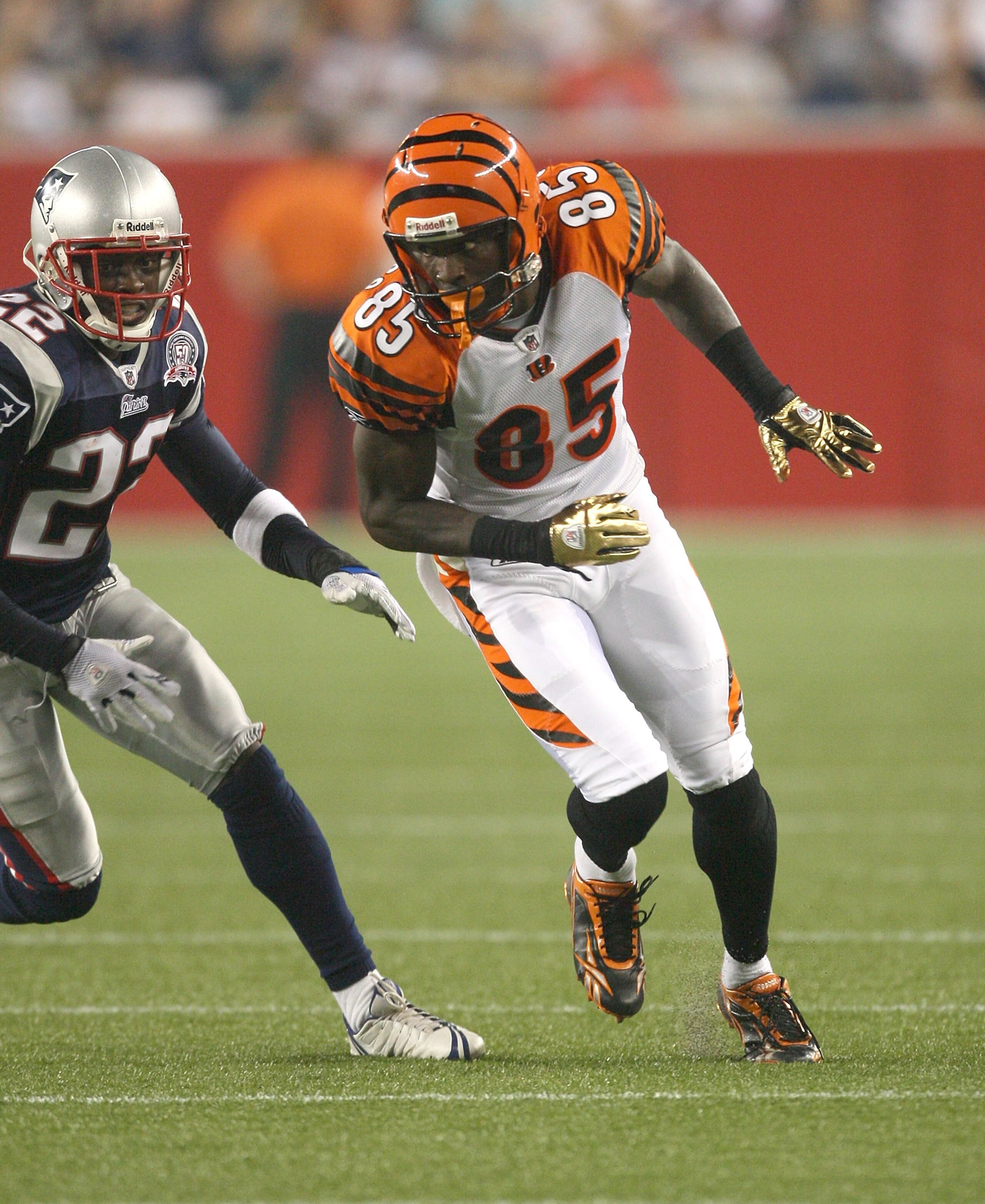 FOXBORO, MA - AUGUST 20:  Terrence Wheatley #22 of the New England Patriots defends against Chad Ochocinco #85 of the Cincinnati Bengals after a preseason game at Gillette Stadium on August 20, 2009 in Foxboro, Massachusetts. (Photo by Jim Rogash/Getty Im