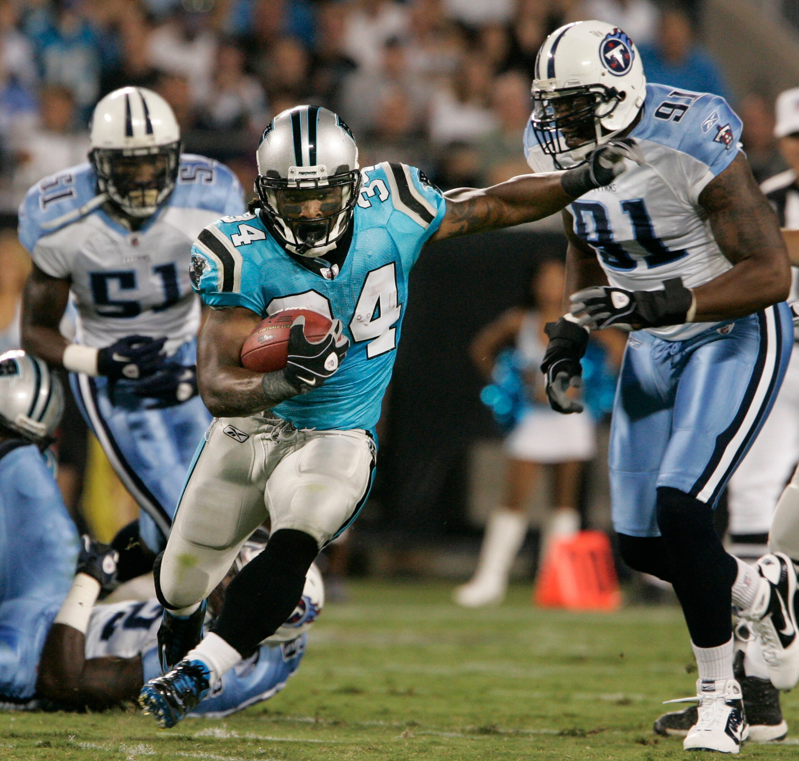 CHARLOTTE, NC -  AUGUST 28:  Runningback DeAngelo Williams #34 of the Carolina Panthers runs for yardage during their preseason game against the Tennessee Titans at Bank of America Stadium on August 28, 2010 in Charlotte, North Carolina. (Photo by Mary An