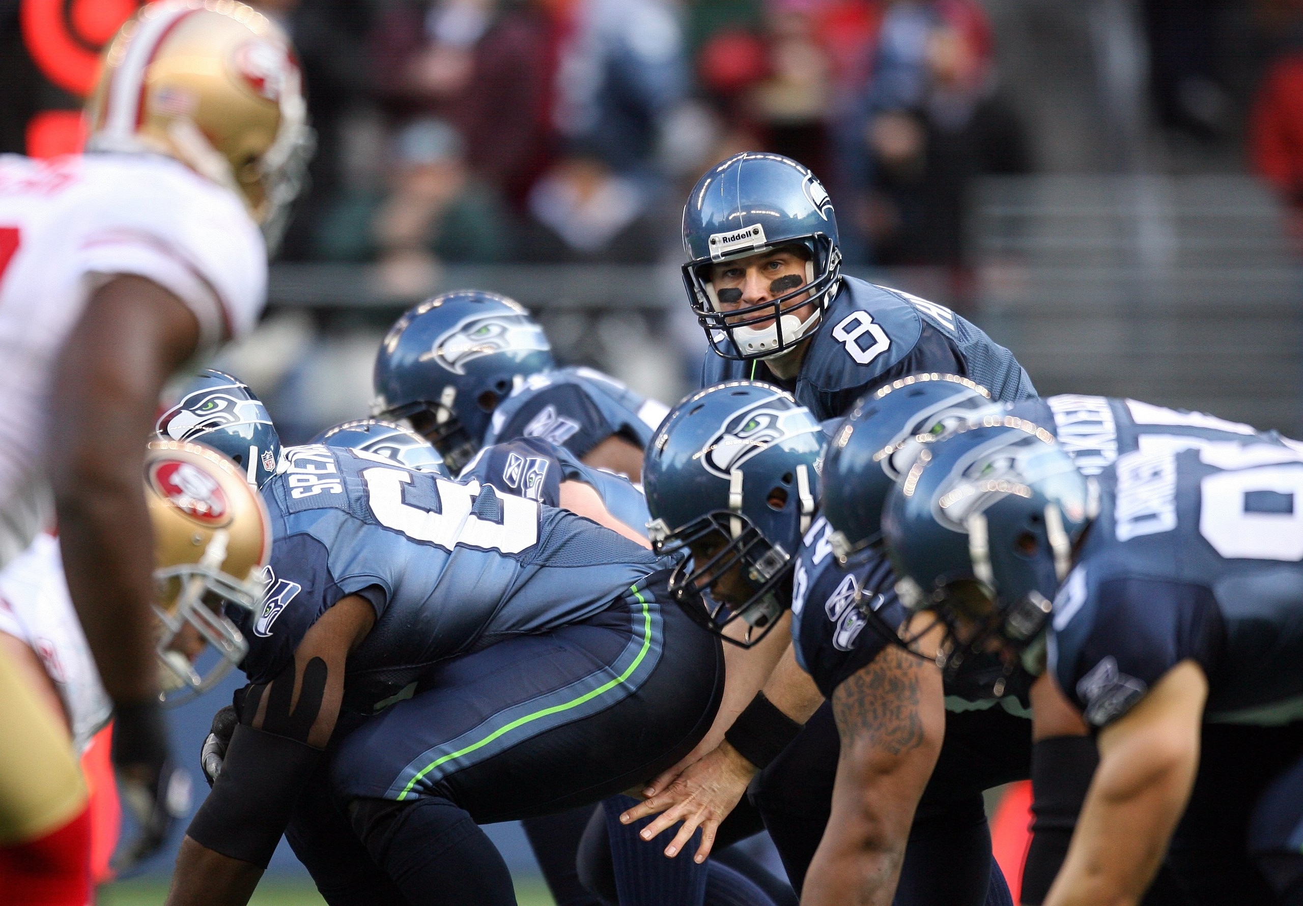 SEATTLE - DECEMBER 6:  Quarterback Matt Hasselbeck #8 of the Seattle Seahawks looks over the defensive formation prior to the snap of the ball during their NFL game against the San Francisco 49ers on December 6, 2009 at Qwest Field in Seattle, Washington.