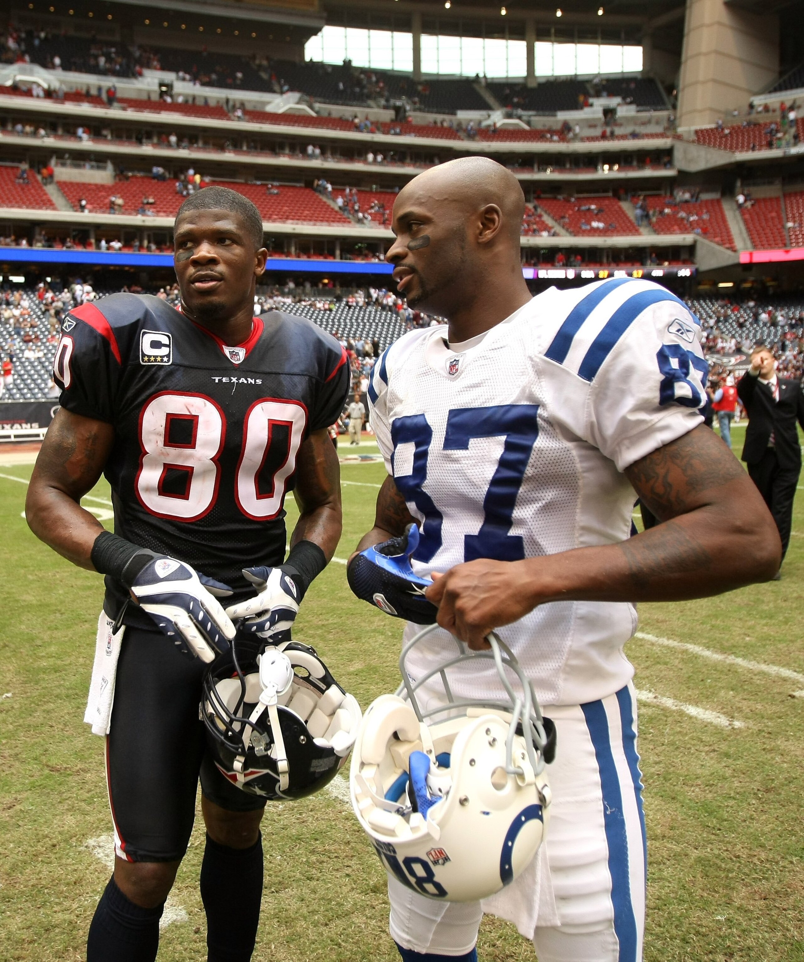 HOUSTON - NOVEMBER 29:  Andre Johnson #80 of the Houston Texans talks with Reggie Wayne #87 of the Indianapolis Colts after their game on November 29, 2009  at Reliant Stadium in Houston, Texas. The Colts won 35-27.  (Photo by Stephen Dunn/Getty Images)