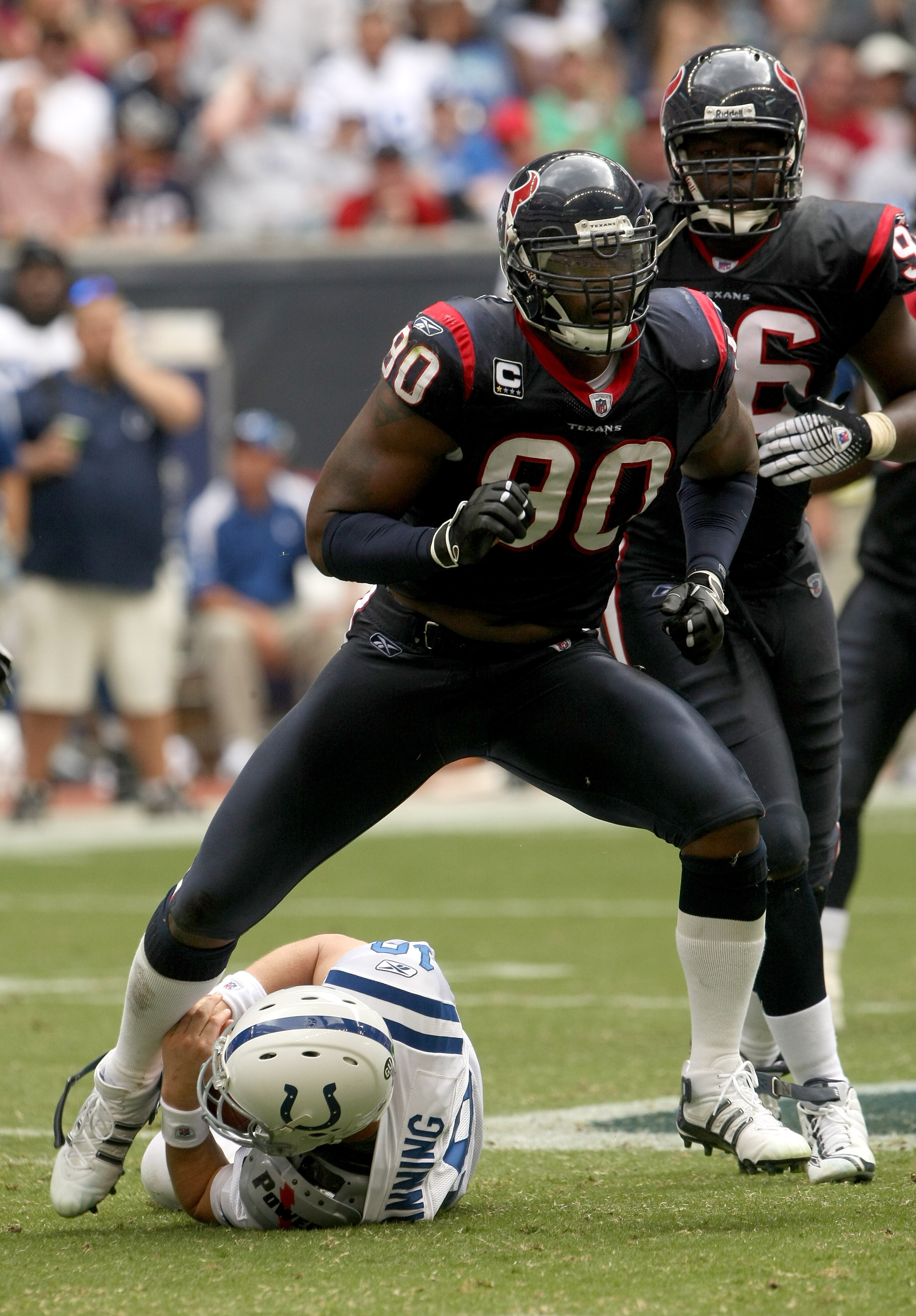 HOUSTON - OCTOBER 05: Defensive end Mario Williams #90 of the Houston Texans celebrates after sacking quarterback Peyton Manning #18 of the Indianapolis Colts on October 5, 2008 at Reliant Stadium in Houston, Texas. The Colts won 31-27. (Photo by Stephe HOUSTON - OCTOBER 05: Defensive end Mario Williams #90 of the Houston Texans celebrates after sacking quarterback Peyton Manning #18 of the Indianapolis Colts on October 5, 2008 at Reliant Stadium in Houston, Texas. The Colts won 31-27. (Photo by Stephe