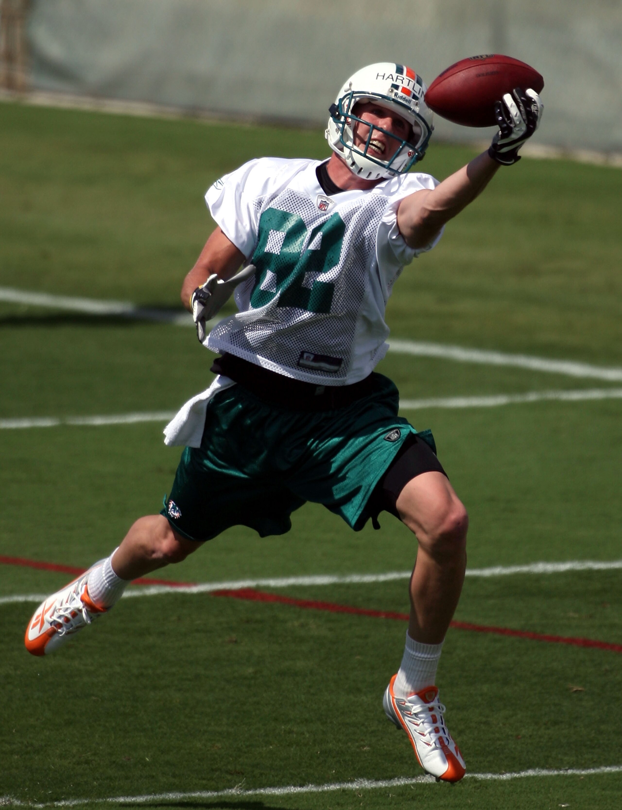 DAVIE, FL - MAY 02:  Rookie wide receiver Brian Hartline #82 of the Miami Dolphins catches a ball during mini camp on May 2, 2009 at the Miami Dolphins Training facility in Davie, Florida.  (Photo by Marc Serota/Getty Images)