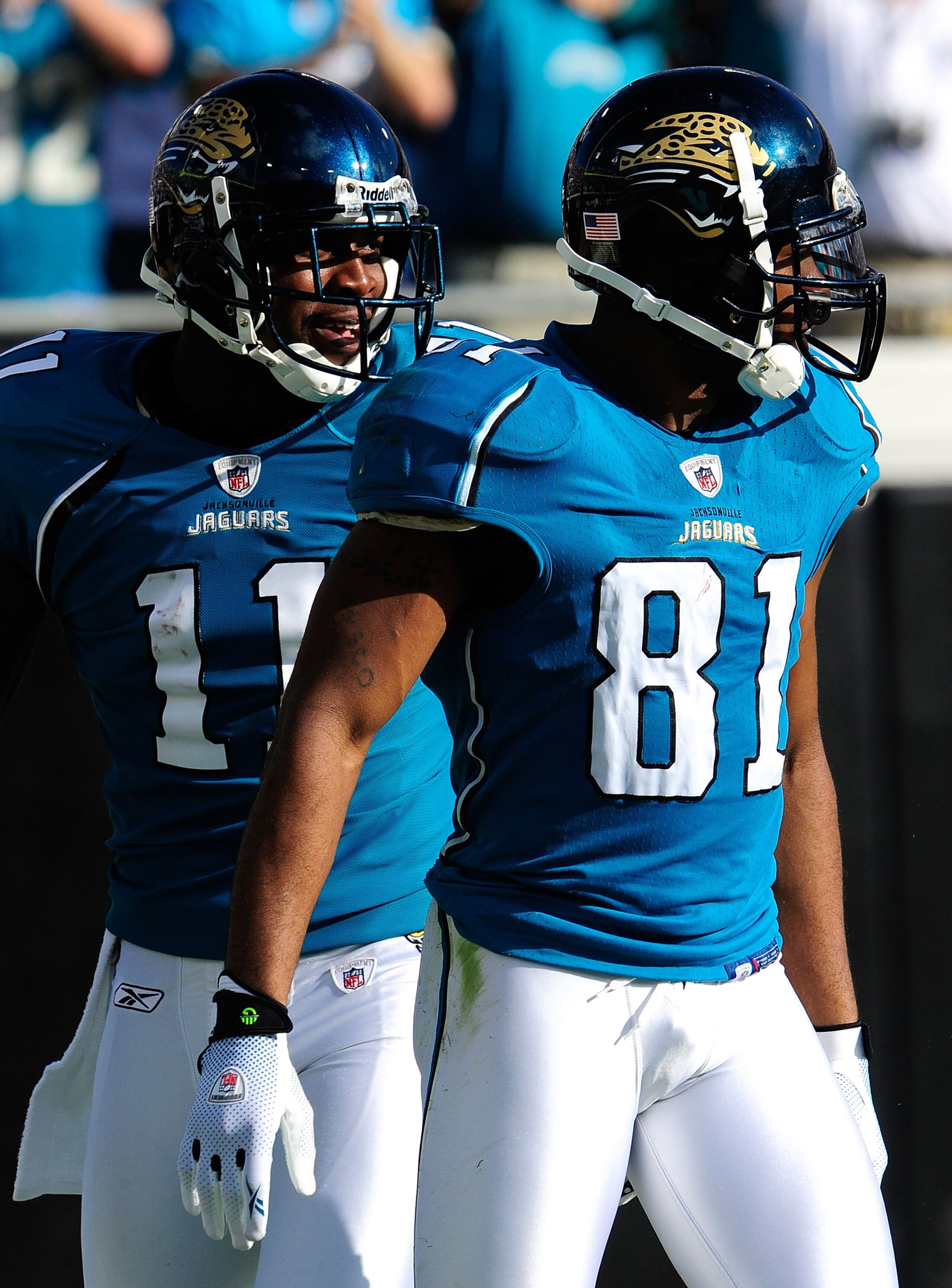 JACKSONVILLE, FL - DECEMBER 13:  Mike Sims-Walker #11 and Torry Holt #81 of the Jacksonville Jaguars look over the defense during the game against the Houston Texans at Jacksonville Municipal Stadium on December 13, 2009 in Jacksonville, Florida.  (Photo