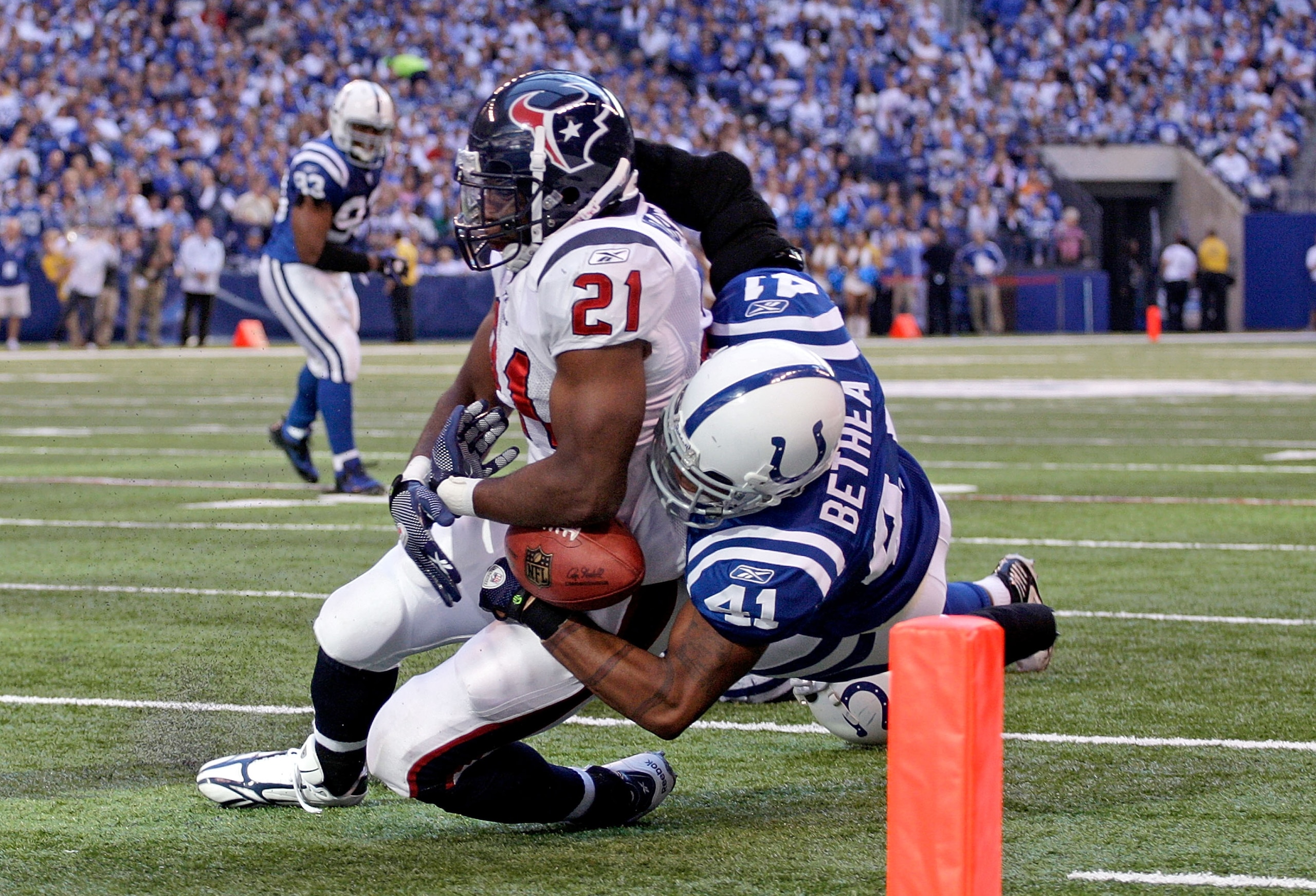 INDIANAPOLIS - NOVEMBER 08:  Antoine Bethea #41 of the Indianapolis Colts causes a fumble as he tackles Ryan Moats #21 of the Houston Texans during the NFL game at Lucas Oil Stadium on November 8, 2009 in Indianapolis, Indiana. The Colts won 20-17.  (Phot
