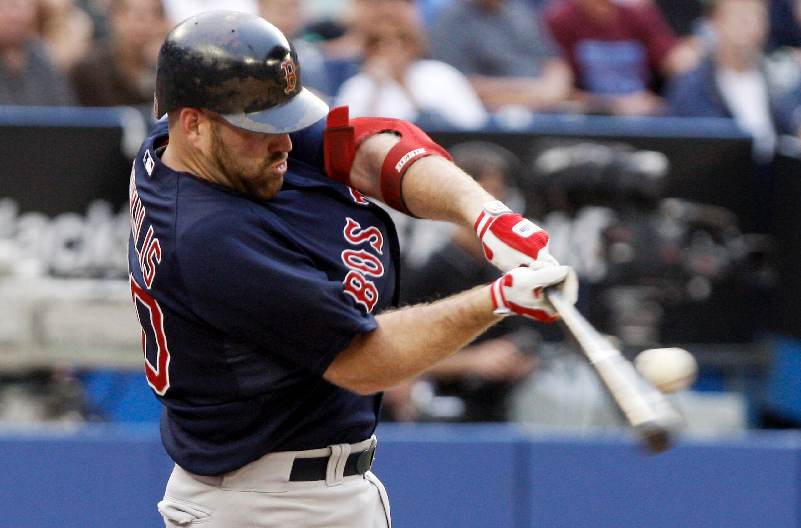 TORONTO - JULY 9: Kevin Youkilis #20 of the Boston Red Sox hits a sacrifice fly RBI during a MLB game at The Rogers Centre against the Toronto Blue Jays on July 9, 2010 in Toronto, Ontario, Canada. (Photo by Abelimages/Getty Images)