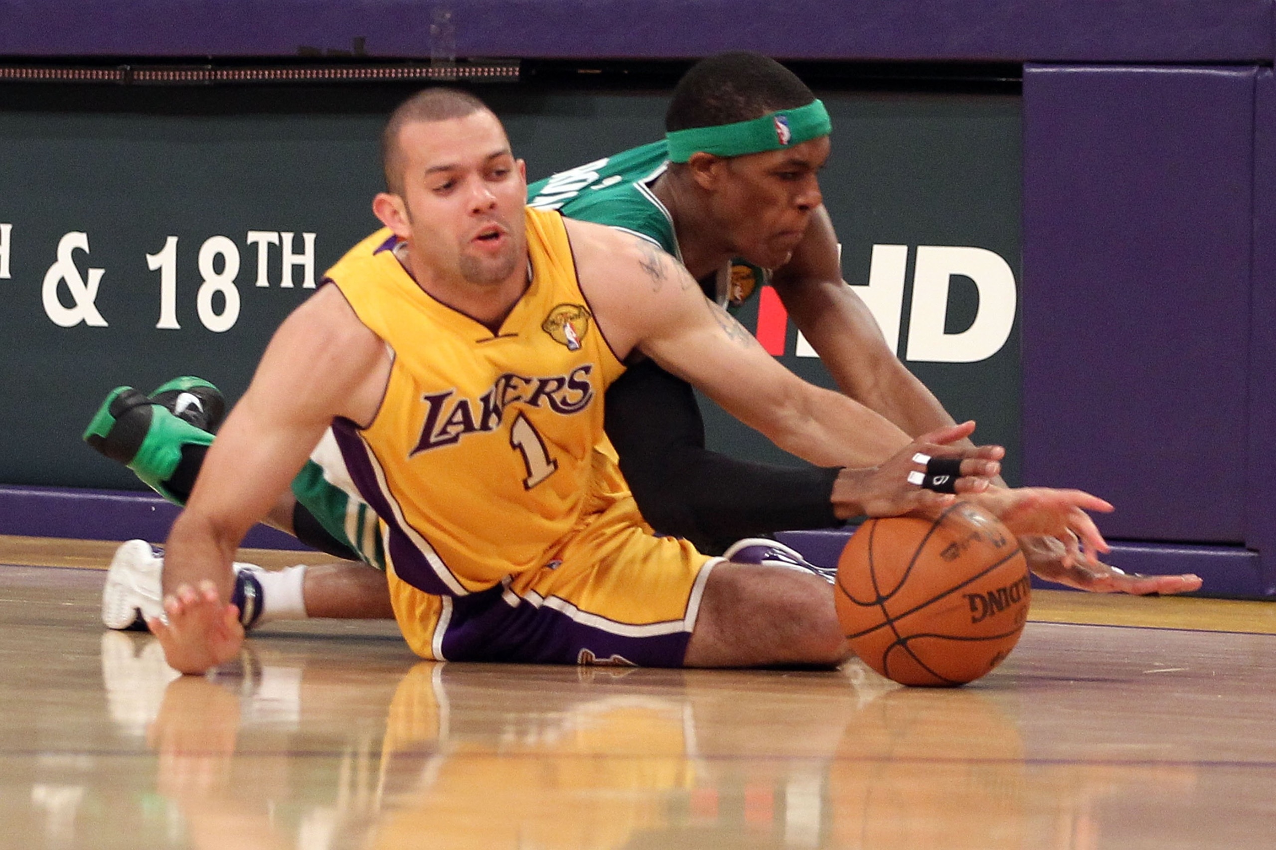 LOS ANGELES, CA - JUNE 15:  Jordan Farmar #1 of the Los Angeles Lakers and Rajon Rondo #9 of the Boston Celtics battle for a loose ball in the second half of Game Six of the 2010 NBA Finals at Staples Center on June 15, 2010 in Los Angeles, California.  N