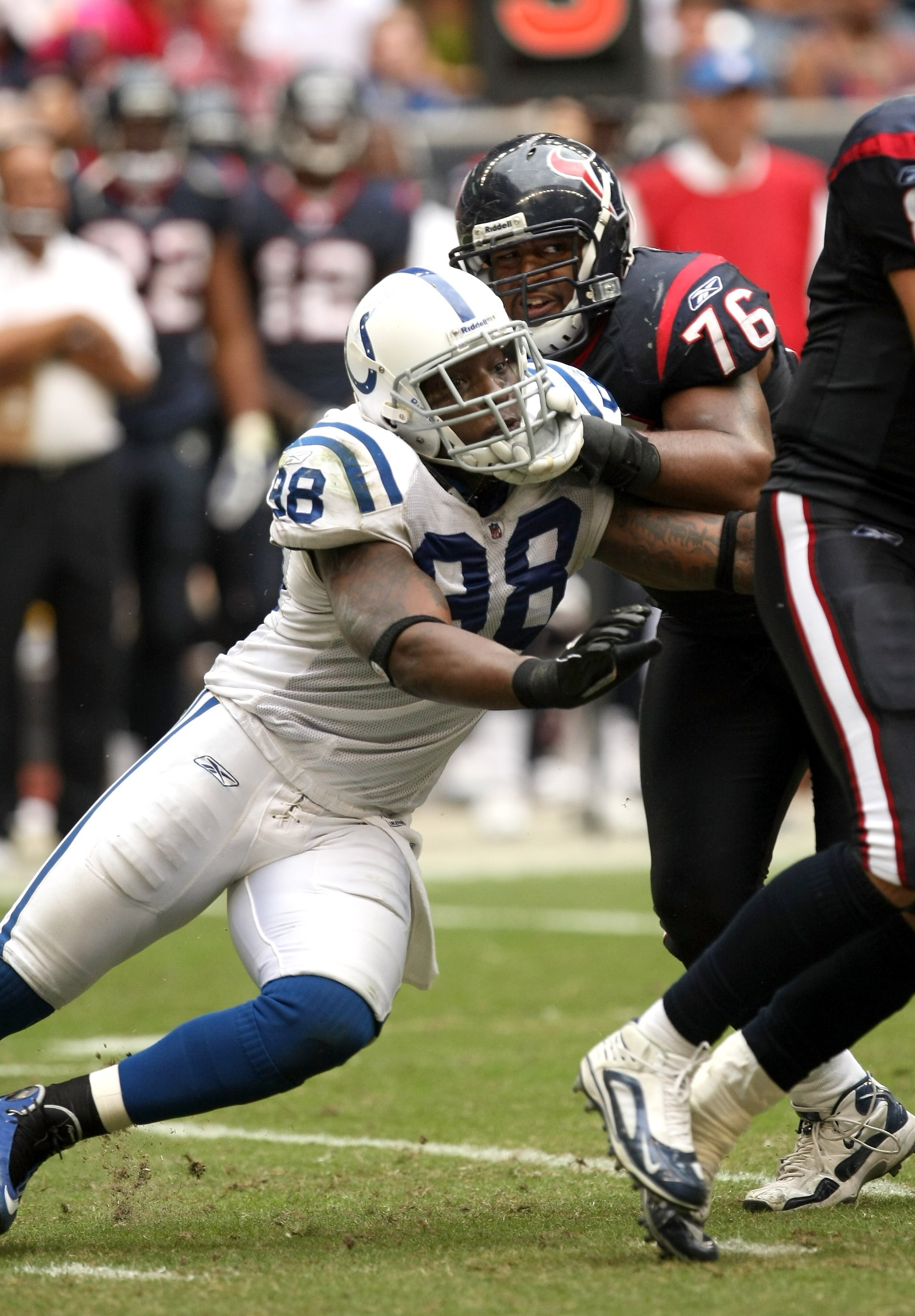 HOUSTON - NOVEMBER 29:  Defensive end Robert Mathis #58 of the Indianapolis Colts rushes against tackle Duane Brown #76 of the Houston Texans on November 29, 2009  at Reliant Stadium in Houston, Texas. The Colts won 35-27.  (Photo by Stephen Dunn/Getty Im