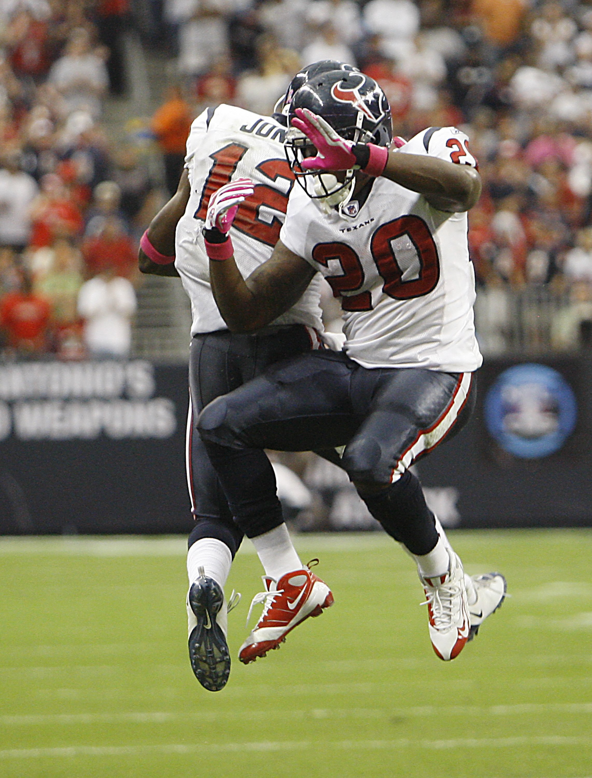 HOUSTON - OCTOBER 04:  Running back Steve Slaton #20 of the Houston Texans celebrates with Jacoby Jones #12 after his score at Reliant Stadium on October 4, 2009 in Houston, Texas.  (Photo by Bob Levey/Getty Images)
