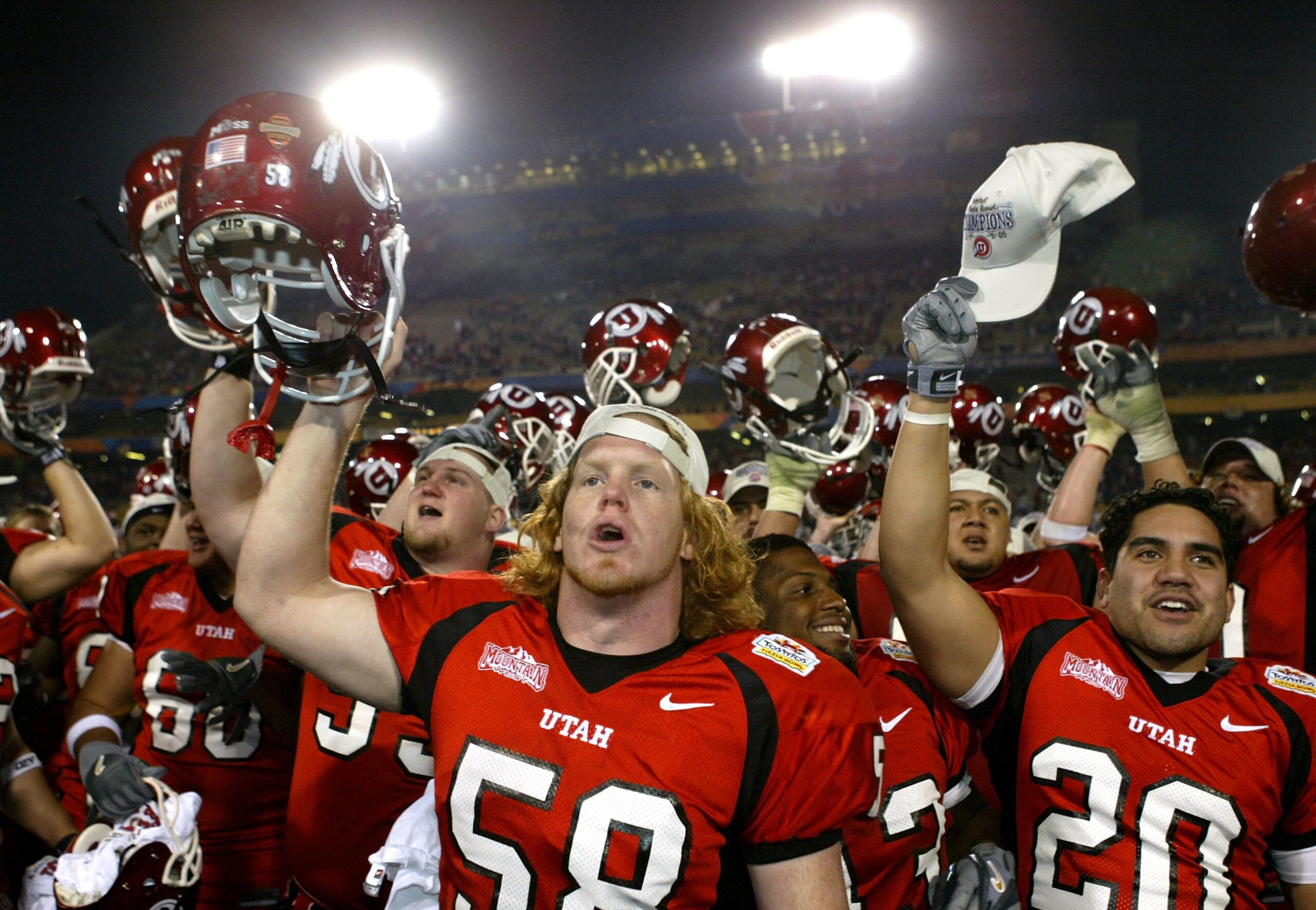 TEMPE, AZ - JANUARY 1:  The Utah team celebrates after defeating Pittsburgh 35-7 in the Tostito's Fiesta Bowl at the Sun Devil Stadium on January 1, 2005 in Tempe, Arizona. (Photo by Jeff Gross/Getty Images).
