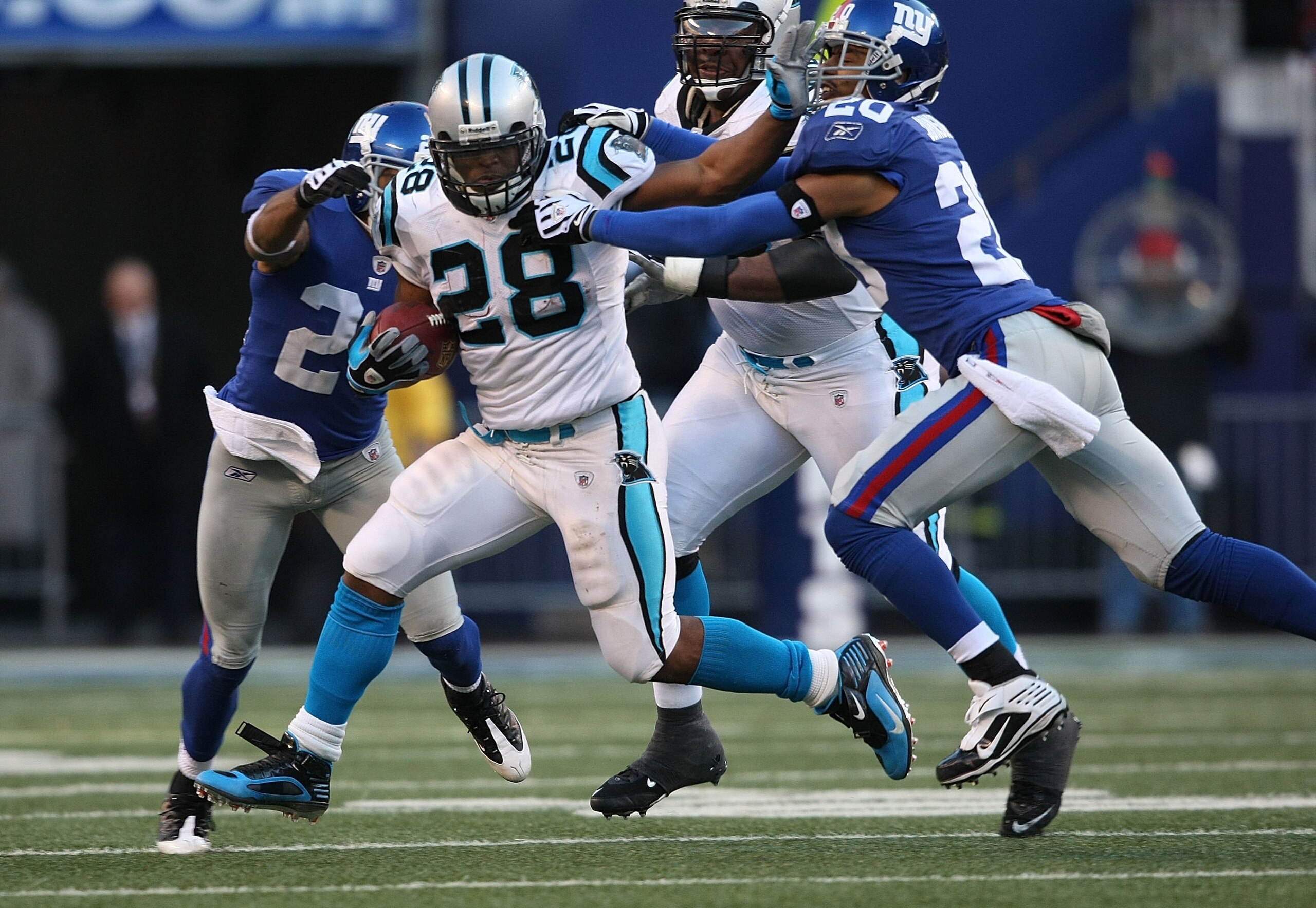 EAST RUTHERFORD, NJ - DECEMBER 27:  Jonathan Stewart #28 of the Carolina Panthers rushes against the New York Giants at Giants Stadium on December 27, 2009 in East Rutherford, New Jersey.  (Photo by Nick Laham/Getty Images)