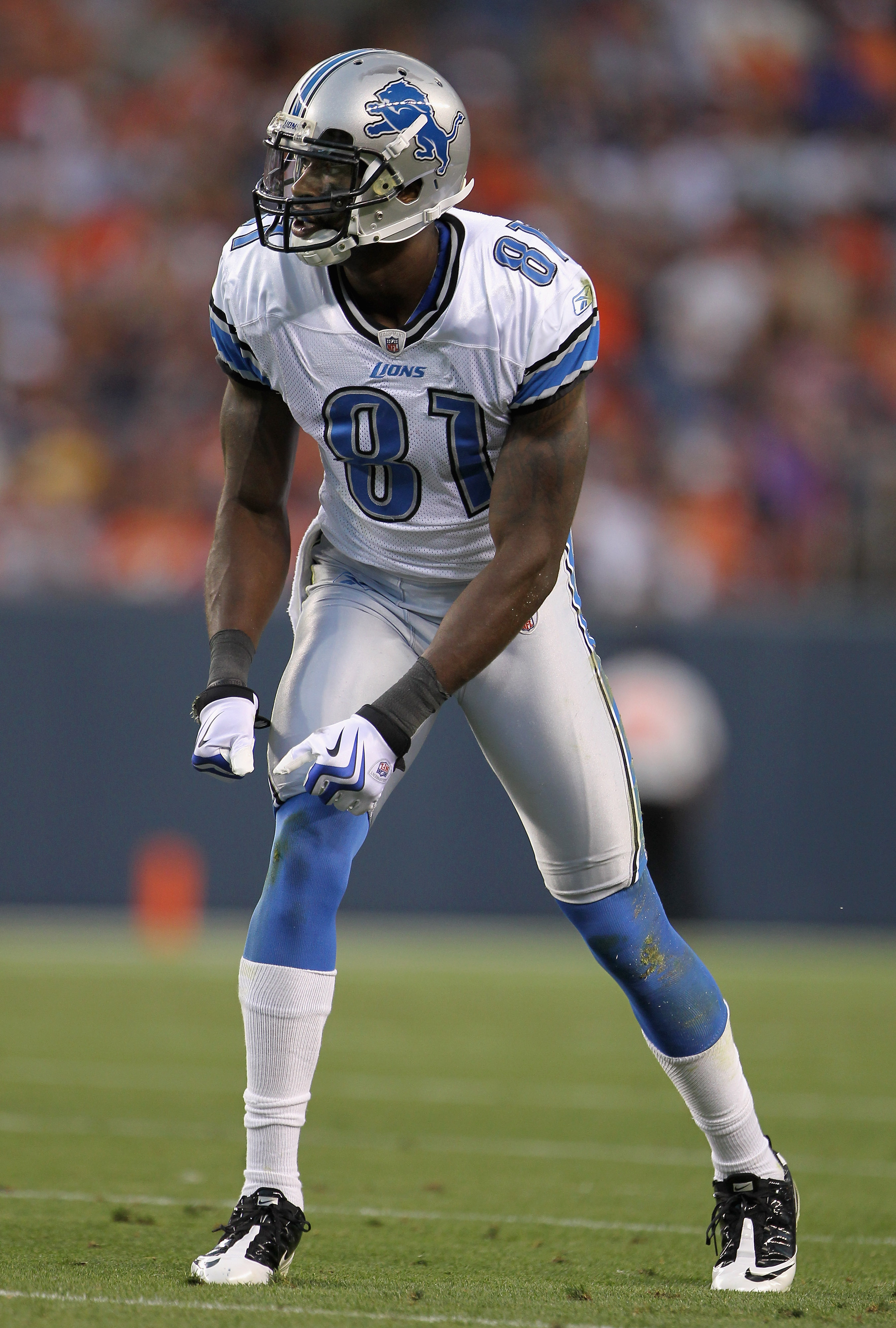 DENVER - AUGUST 21:  Wide receiver Calvin Johnson #81 of the Detroit Lions awaits the snap on the line of scrimmage against the Denver Broncos during preseason NFL action at INVESCO Field at Mile High on August 21, 2010 in Denver, Colorado. The Lions defe