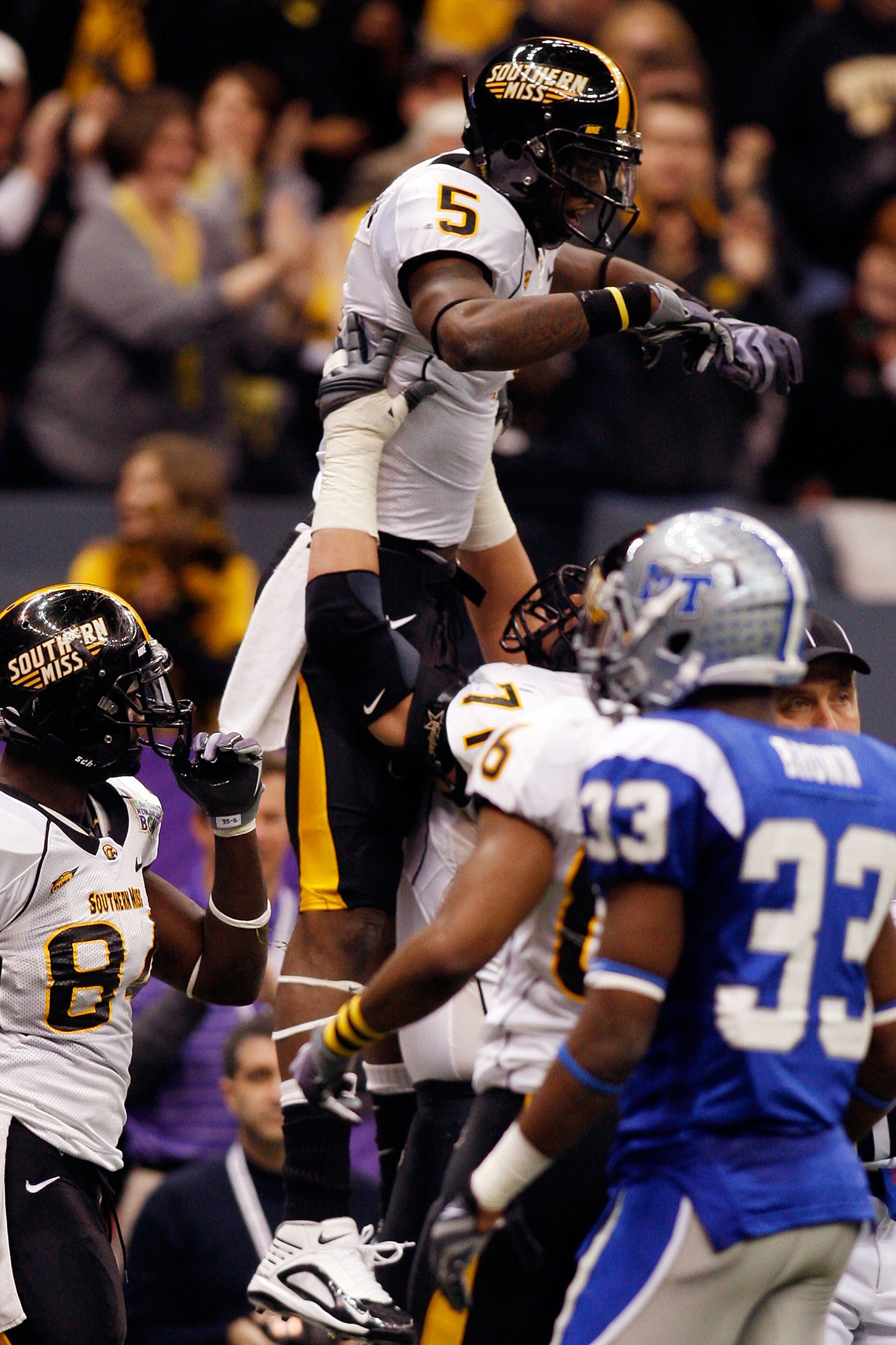 NEW ORLEANS - DECEMBER 20:  DeAndre Brown #5 of the Southern Miss Golden Eagles celebrates after catching a touchdown pass against the Middle Tennessee Blue Raiders during the R+L Carriers New Orleans Bowl at the Louisiana Superdome on December 20, 2009 i