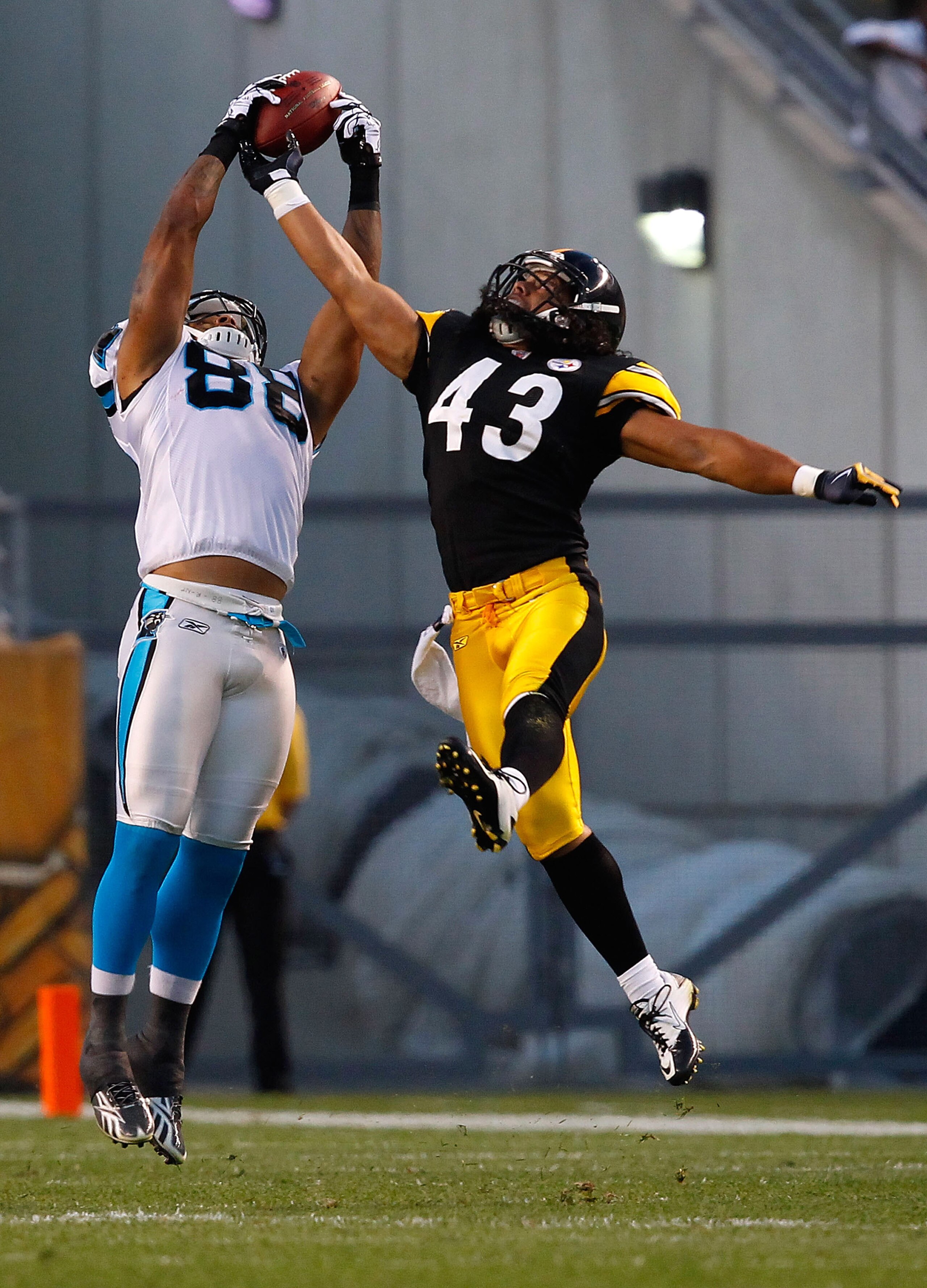 PITTSBURGH - SEPTEMBER 02:  Dante Rosario #88 of the Carolina Panthers catches a pass in front of Troy Polamalu #43 of the Pittsburgh Steelers during the preseason game on September 2, 2010 at Heinz Field in Pittsburgh, Pennsylvania.  (Photo by Jared Wick