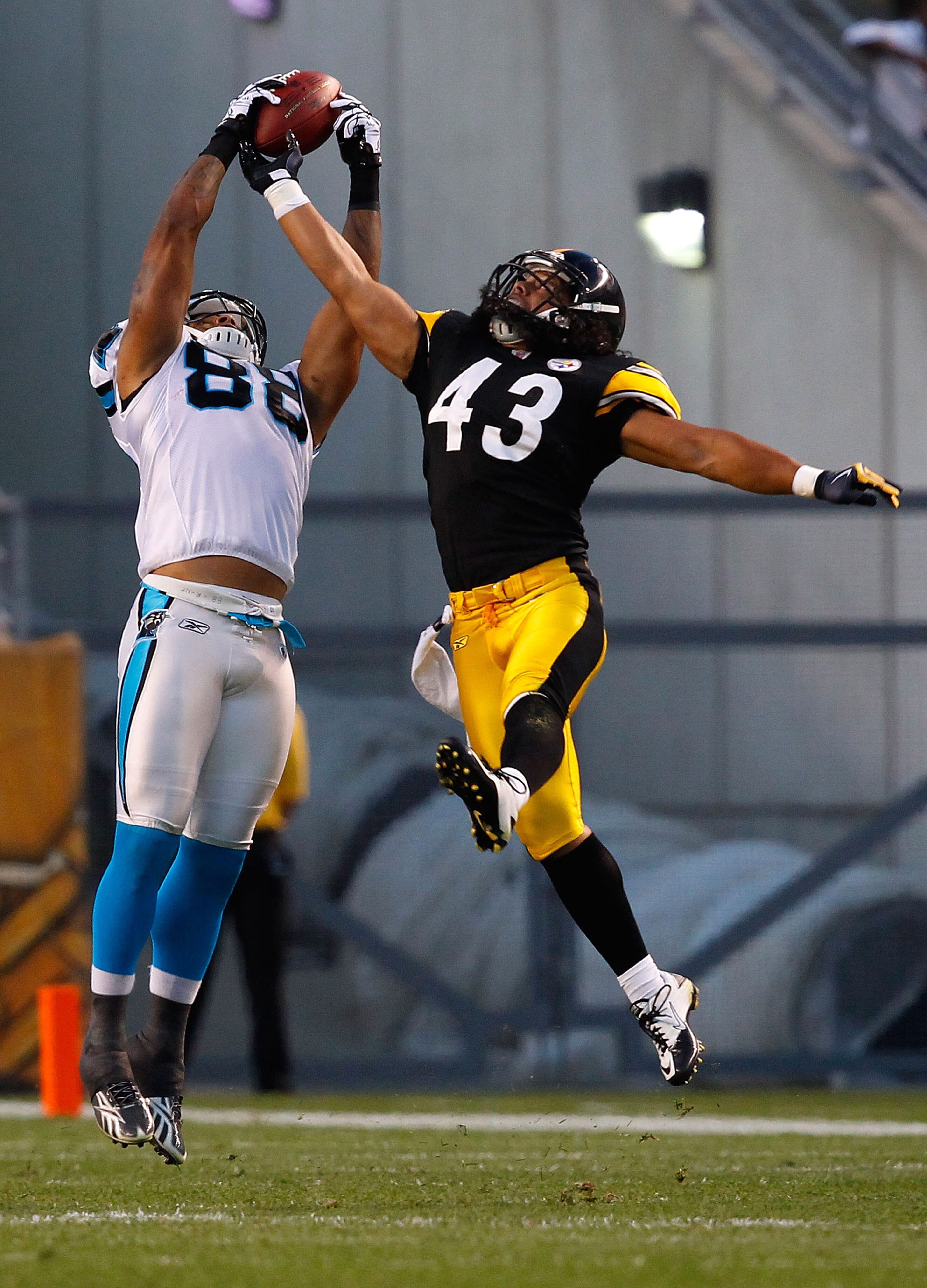 PITTSBURGH - SEPTEMBER 02:  Dante Rosario #88 of the Carolina Panthers catches a pass in front of Troy Polamalu #43 of the Pittsburgh Steelers during the preseason game on September 2, 2010 at Heinz Field in Pittsburgh, Pennsylvania.  (Photo by Jared Wick