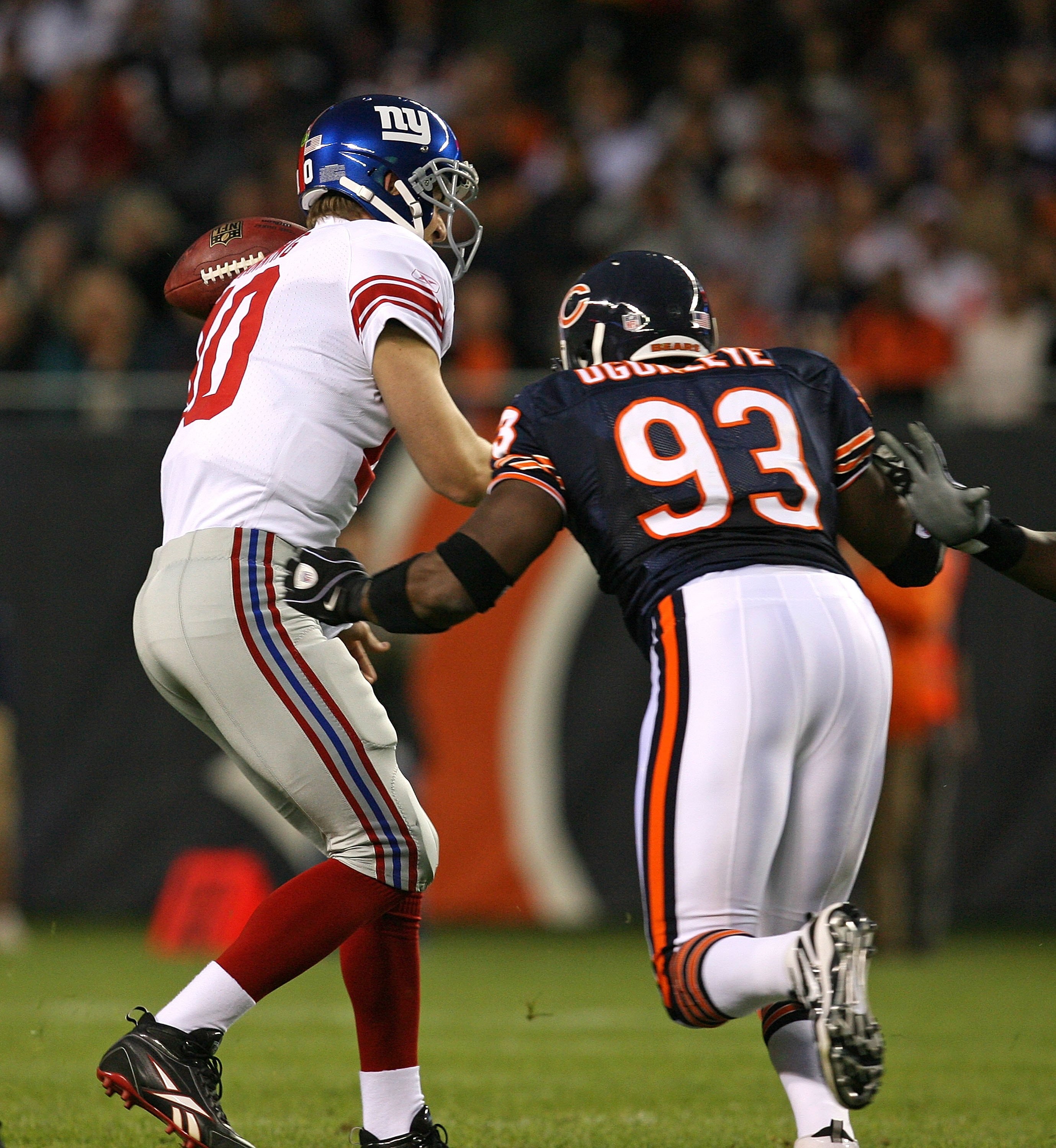 CHICAGO - AUGUST 22: Adewale Ogunleye #93 of the Chicago Bears forces a fumble from Eli Manning #10 of the New York Giants during a pre-season game on August 22, 2009 at Soldier Field in Chicago, Illinois. The Bears defeated the Giants 17-3. (Photo by Jon CHICAGO - AUGUST 22: Adewale Ogunleye #93 of the Chicago Bears forces a fumble from Eli Manning #10 of the New York Giants during a pre-season game on August 22, 2009 at Soldier Field in Chicago, Illinois. The Bears defeated the Giants 17-3. (Photo by Jon