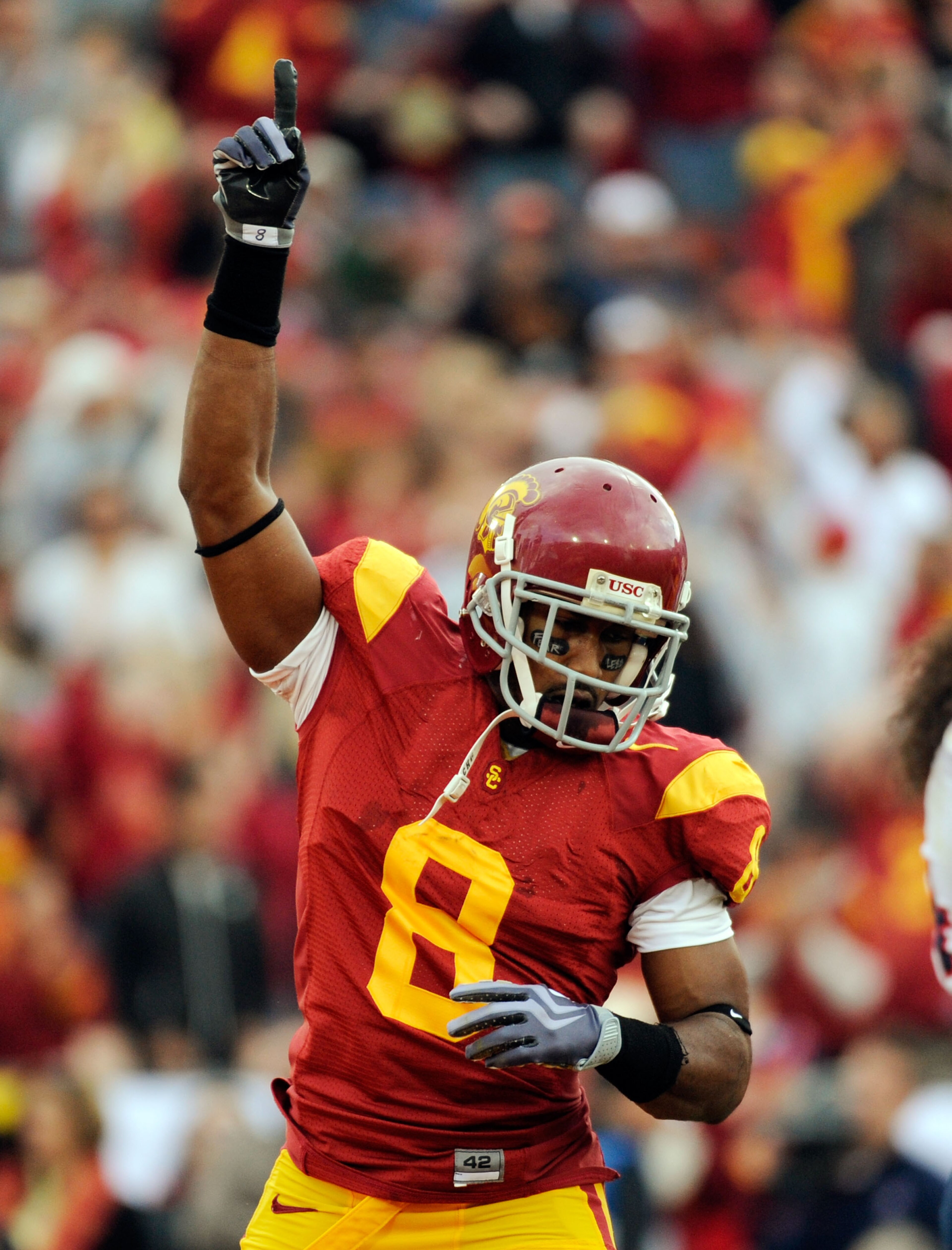 LOS ANGELES, CA - DECEMBER 05: Wide receiver Ronald Johnson #8 of the USC Trojans celebrates his touchdwon against the Arizona Wildcats during the second quarter of the NCAA college football game at the Los Angeles Coliseum on December 5, 2009 in Los Ange