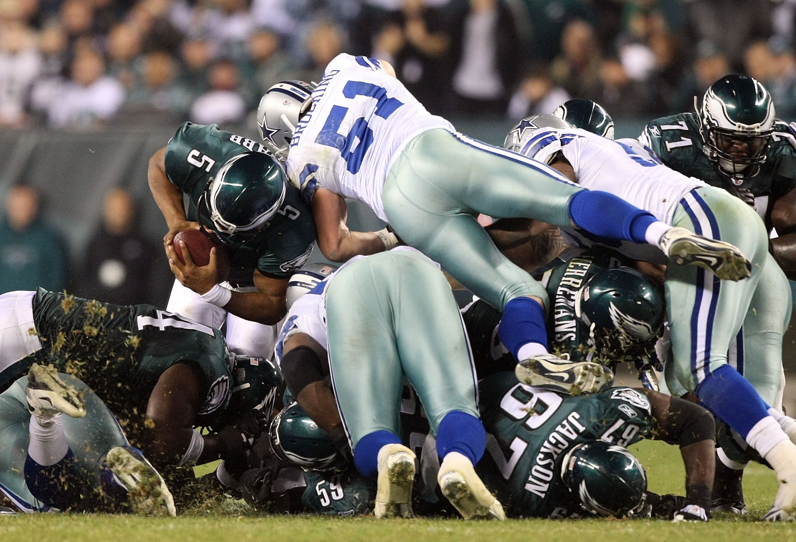 PHILADELPHIA - NOVEMBER 08:  Donovan McNabb #5 of the Philadelphia Eagles is stopped on a 4 and 1 play in the fourth quarter against Keith Brooking #51 of the Dallas Cowboys at Lincoln Financial Field on November 8, 2009 in Philadelphia, Pennsylvania.  (P