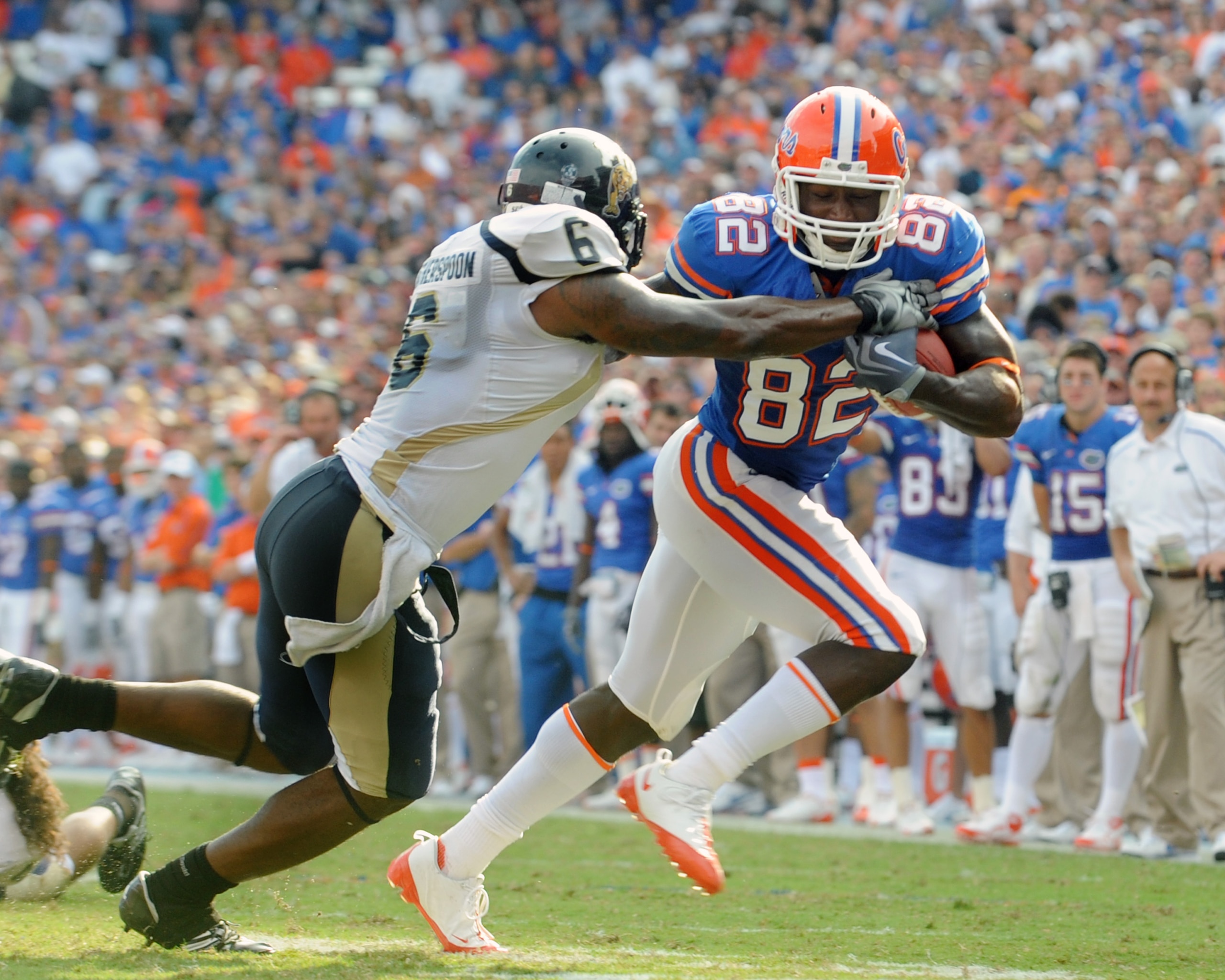 GAINESVILLE, FL - NOVEMBER 21: Wide receiver Omarius Hines #82 of the Florida Gators rushes upfield with a pass for a touchdown against the Florida International University Golden Panthers, November 21, 2009 at Ben Hill Griffin Stadium in Gainesville, Flo GAINESVILLE, FL - NOVEMBER 21: Wide receiver Omarius Hines #82 of the Florida Gators rushes upfield with a pass for a touchdown against the Florida International University Golden Panthers, November 21, 2009 at Ben Hill Griffin Stadium in Gainesville, Flo