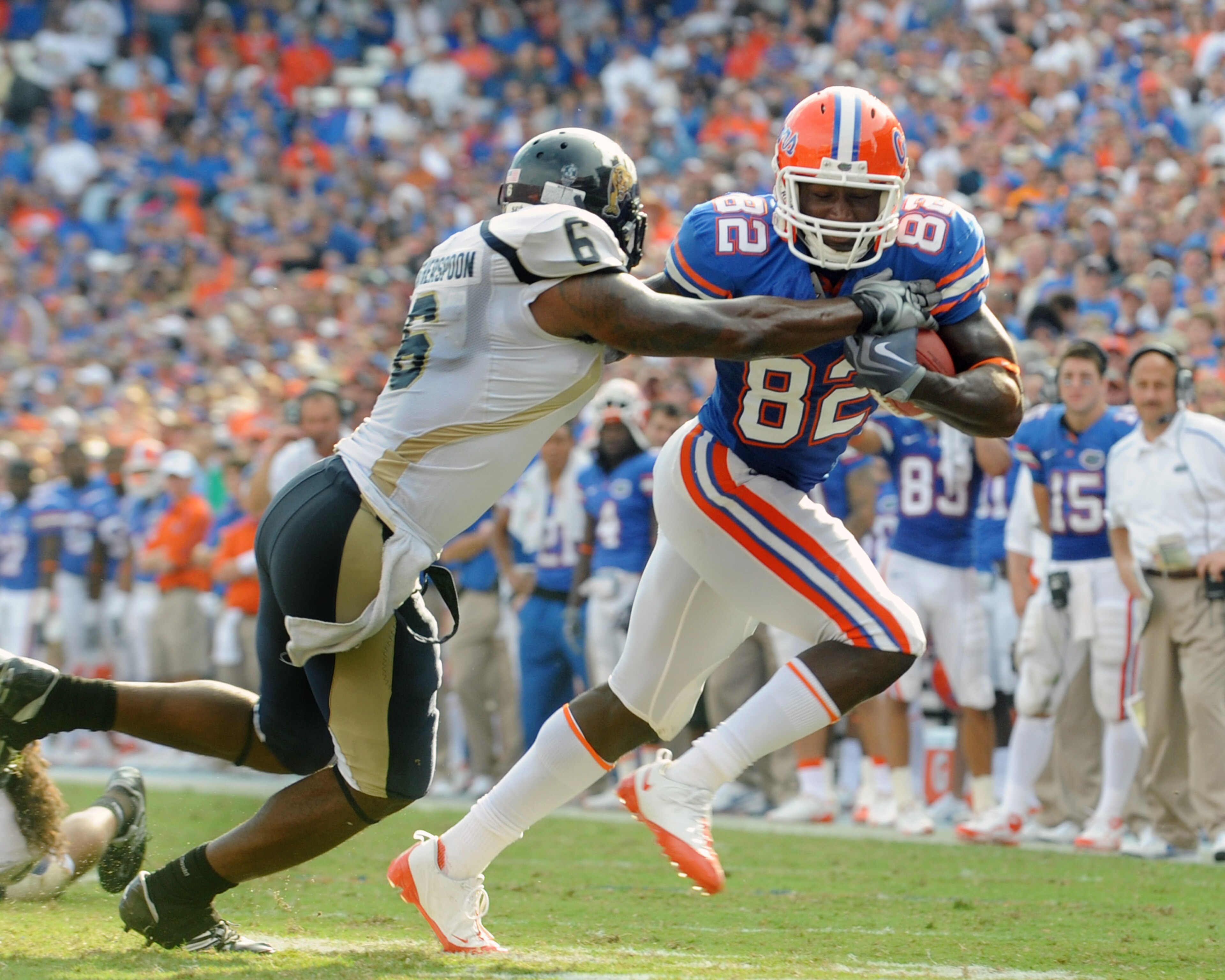 GAINESVILLE, FL - NOVEMBER 21: Wide receiver Omarius Hines #82 of the Florida Gators rushes upfield with a pass for a touchdown against the Florida International University Golden Panthers, November 21, 2009 at Ben Hill Griffin Stadium in Gainesville, Flo