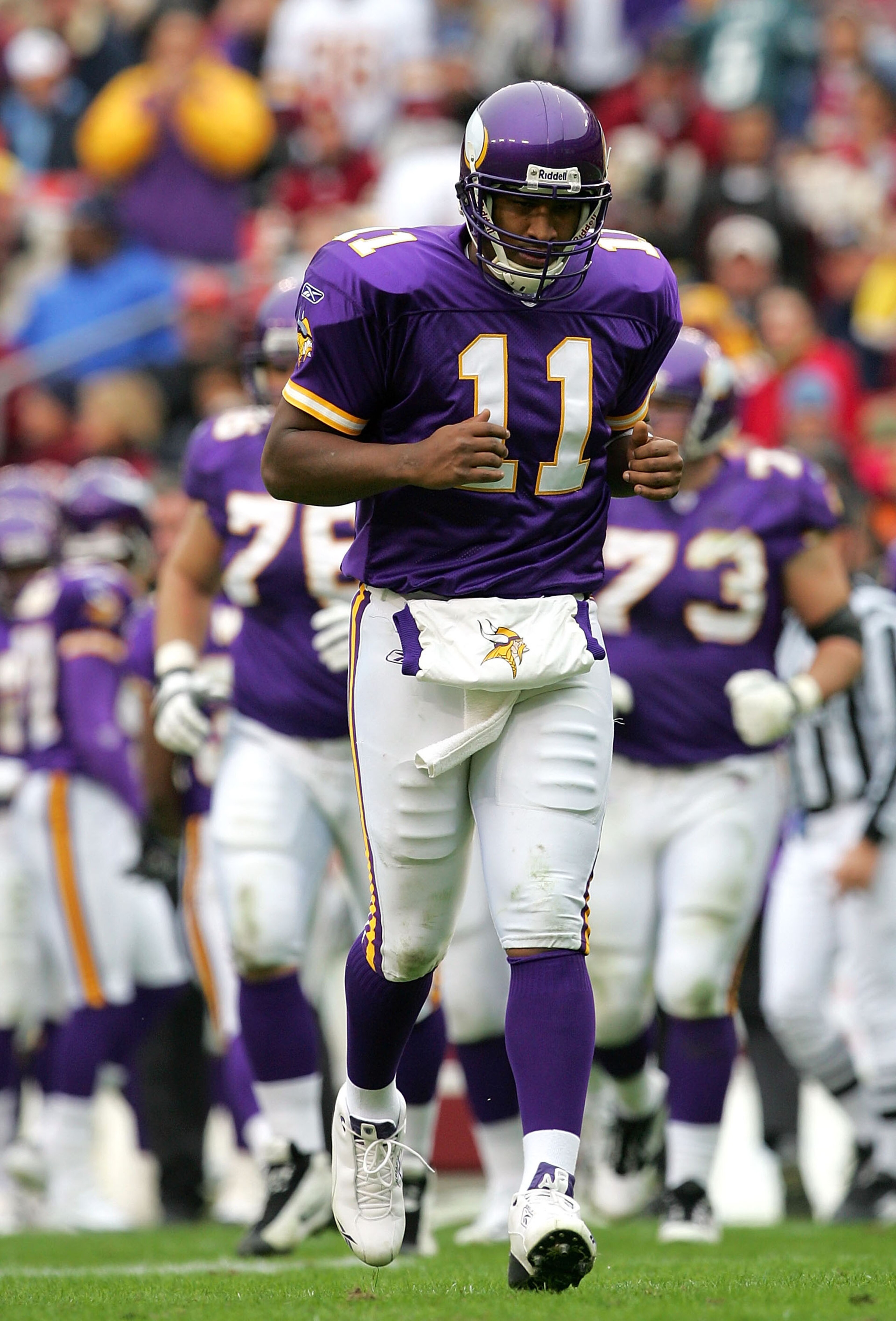 LANDOVER, MD - JANUARY 2:  Quarterback Duante Culpepper #11 of the Minnesota Vikings hangs his head during the first half of the game against the Washington Redskins at FedEx Field on January 2, 2005 in Landover, Maryland.  (Photo by Jamie Squire/Getty Im