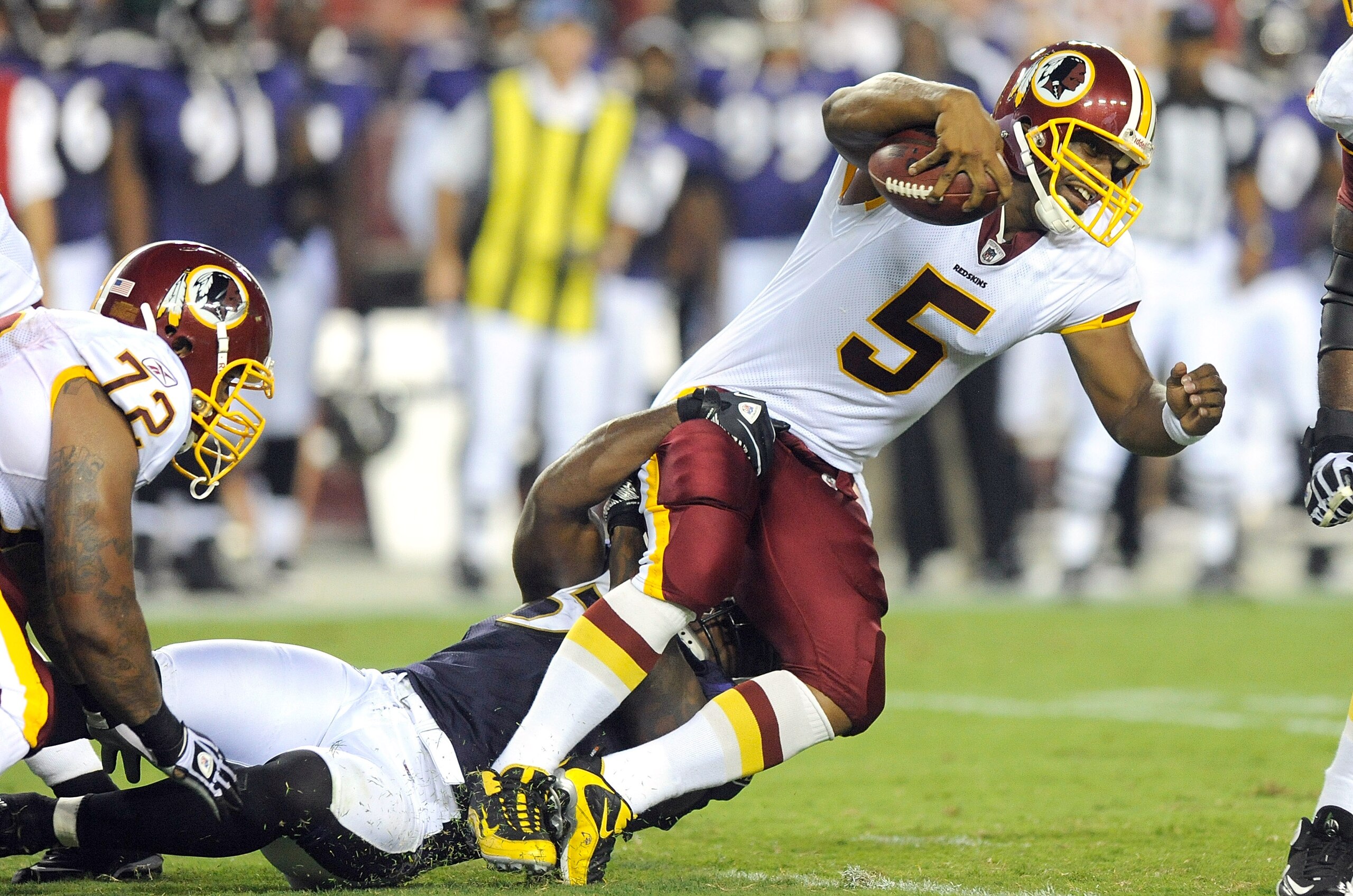 LANDOVER, MD - AUGUST 21:  Donovan McNabb #5 of the Washington Redskins is tackled during the preseason game by Terrell Suggs #55 of the Baltimore Ravens at FedExField on August 21, 2010 in Landover, Maryland.  (Photo by Greg Fiume/Getty Images)