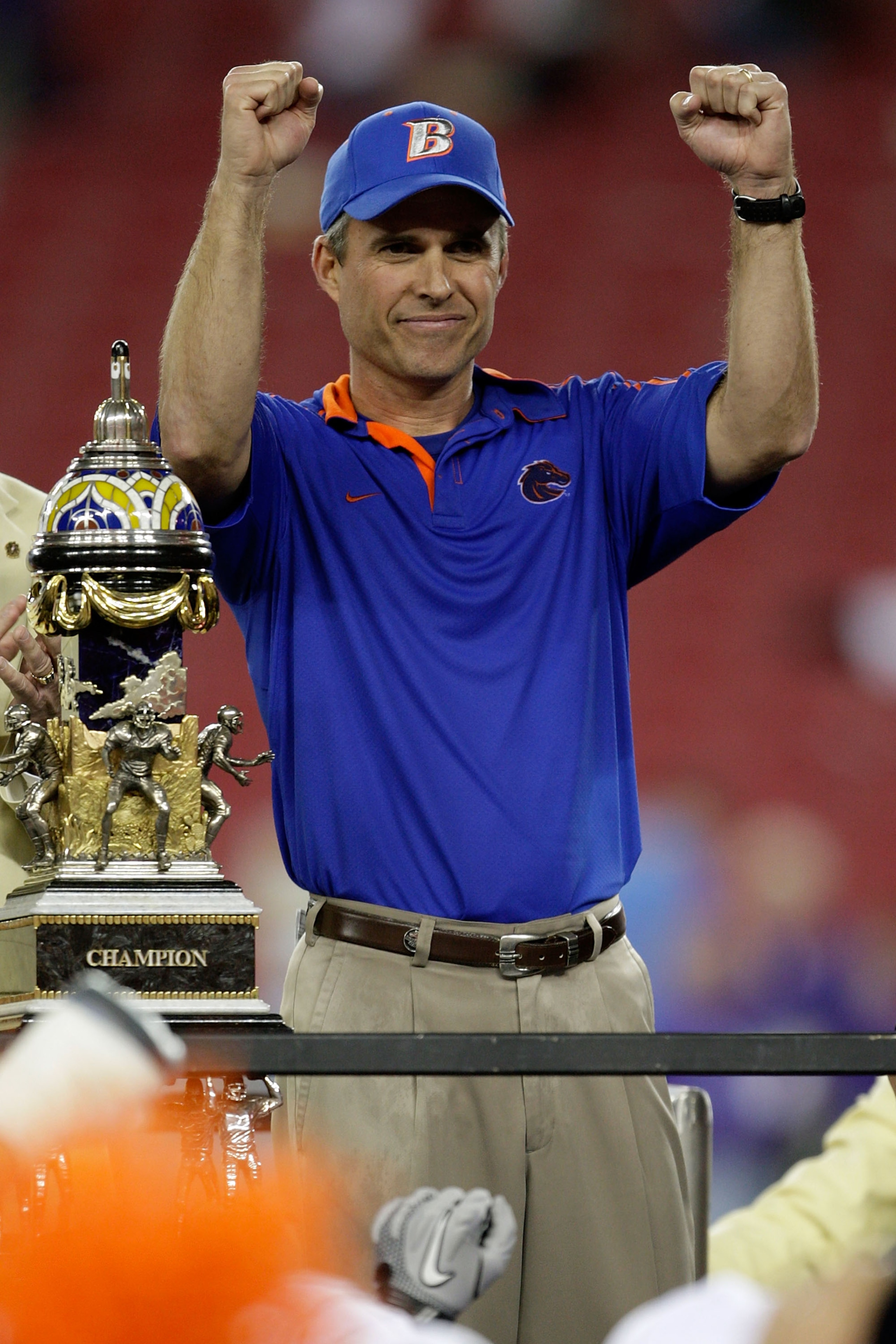 GLENDALE, AZ - JANUARY 04:  Head coach Chris Petersen of the Boise State Broncos celebrates after defeating the TCU Horned Frogs 17-10 during the Tostitos Fiesta Bowl at the Universtity of Phoenix Stadium on January 4, 2010 in Glendale, Arizona.  (Photo b