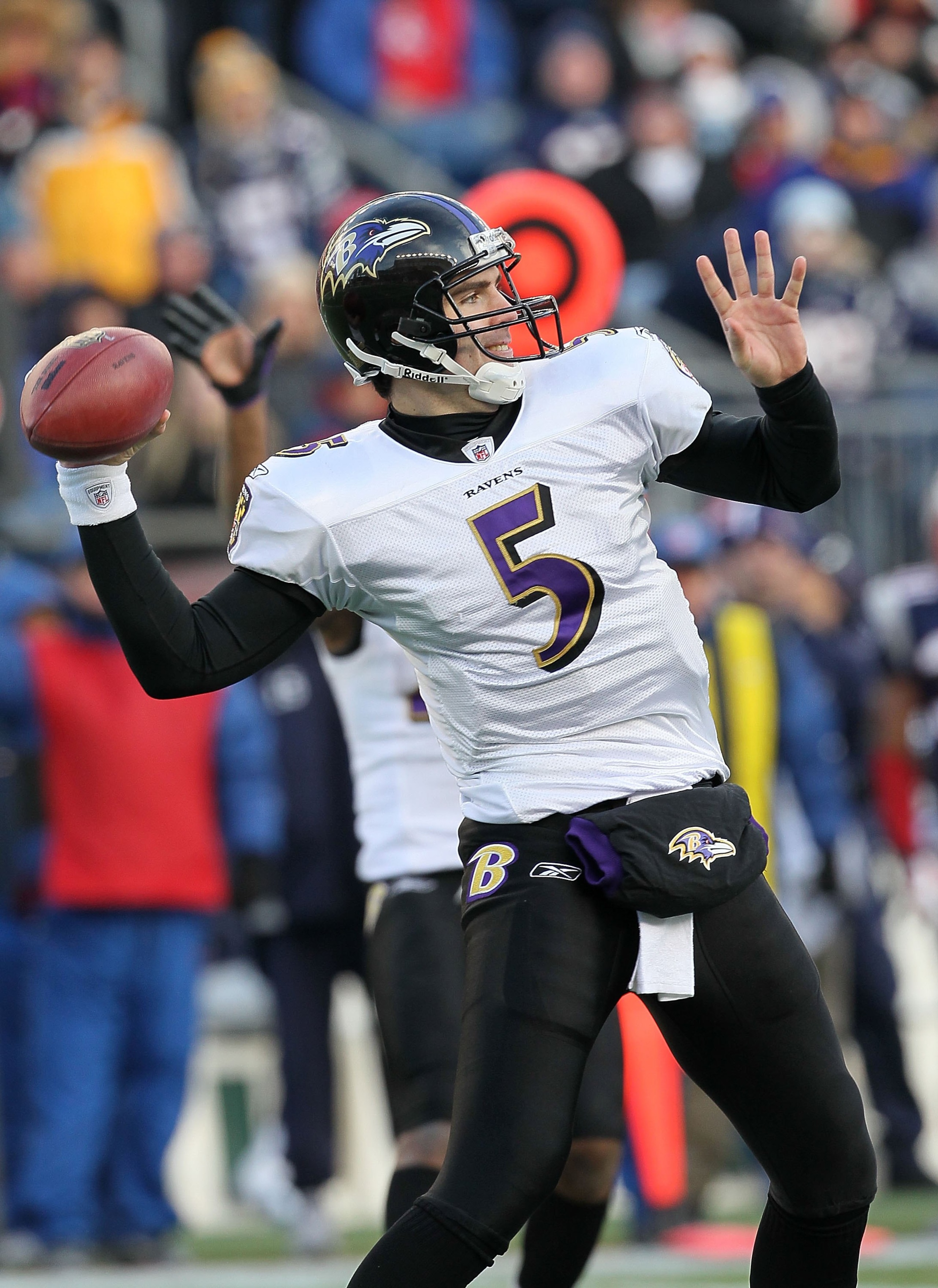 FOXBORO, MA - JANUARY 10:  Quarterback Joe Flacco #5 of the Baltimore Ravens throws a pass against the New England Patriots during the 2010 AFC wild-card playoff game at Gillette Stadium on January 10, 2010 in Foxboro, Massachusetts. The Ravens won 33-14.