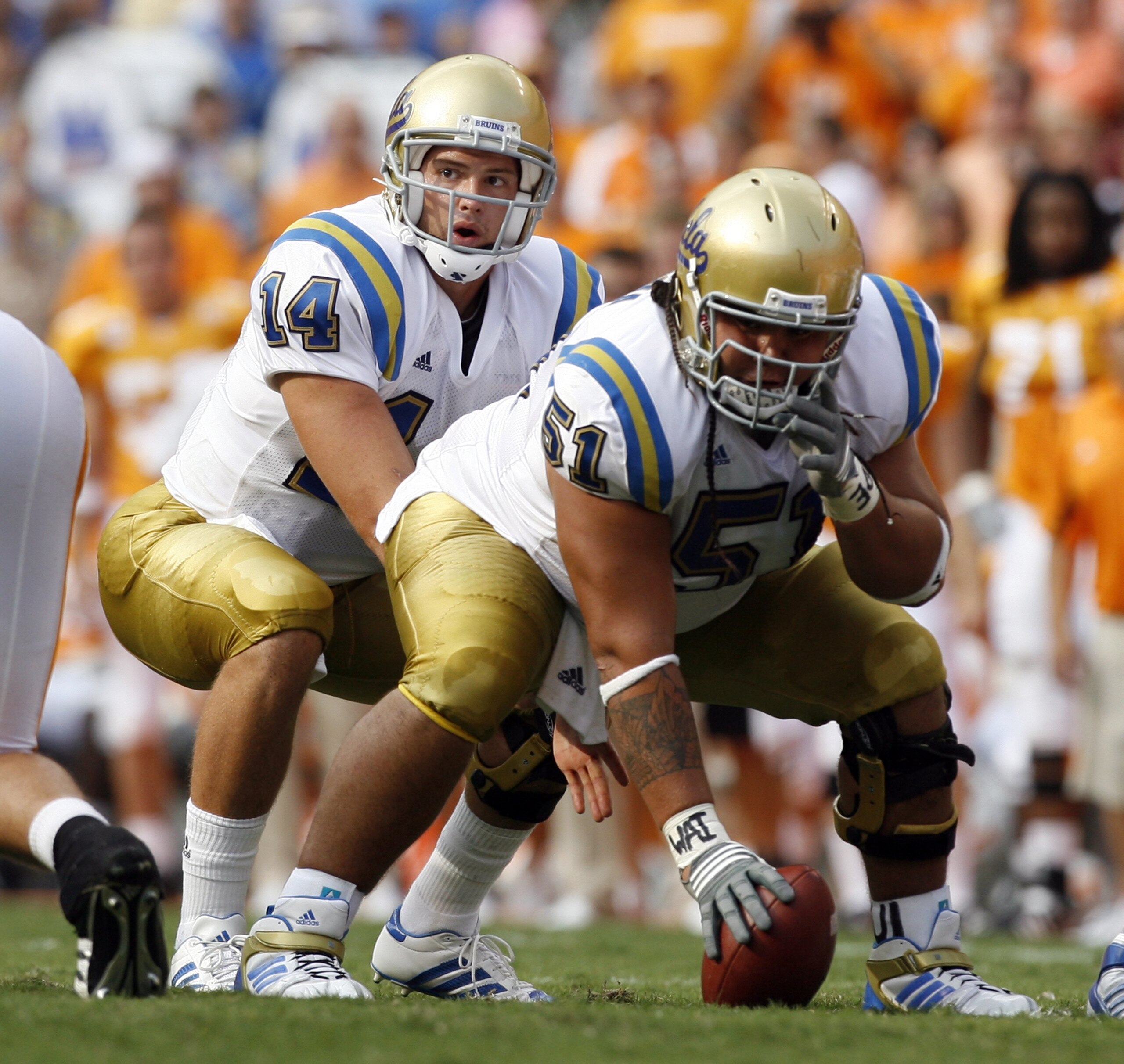 KNOXVILLE, TN - SEPTEMBER 12: Kevin Prince #14 sets himself behind Kai Maiava #51 of the UCLA Bruins against the Tennessee Volunteers on September 12, 2009 at Neyland Stadium in Knoxville, Tennessee. UCLA beat Tennessee 19-15. (Photo by Joe Murphy/Getty I