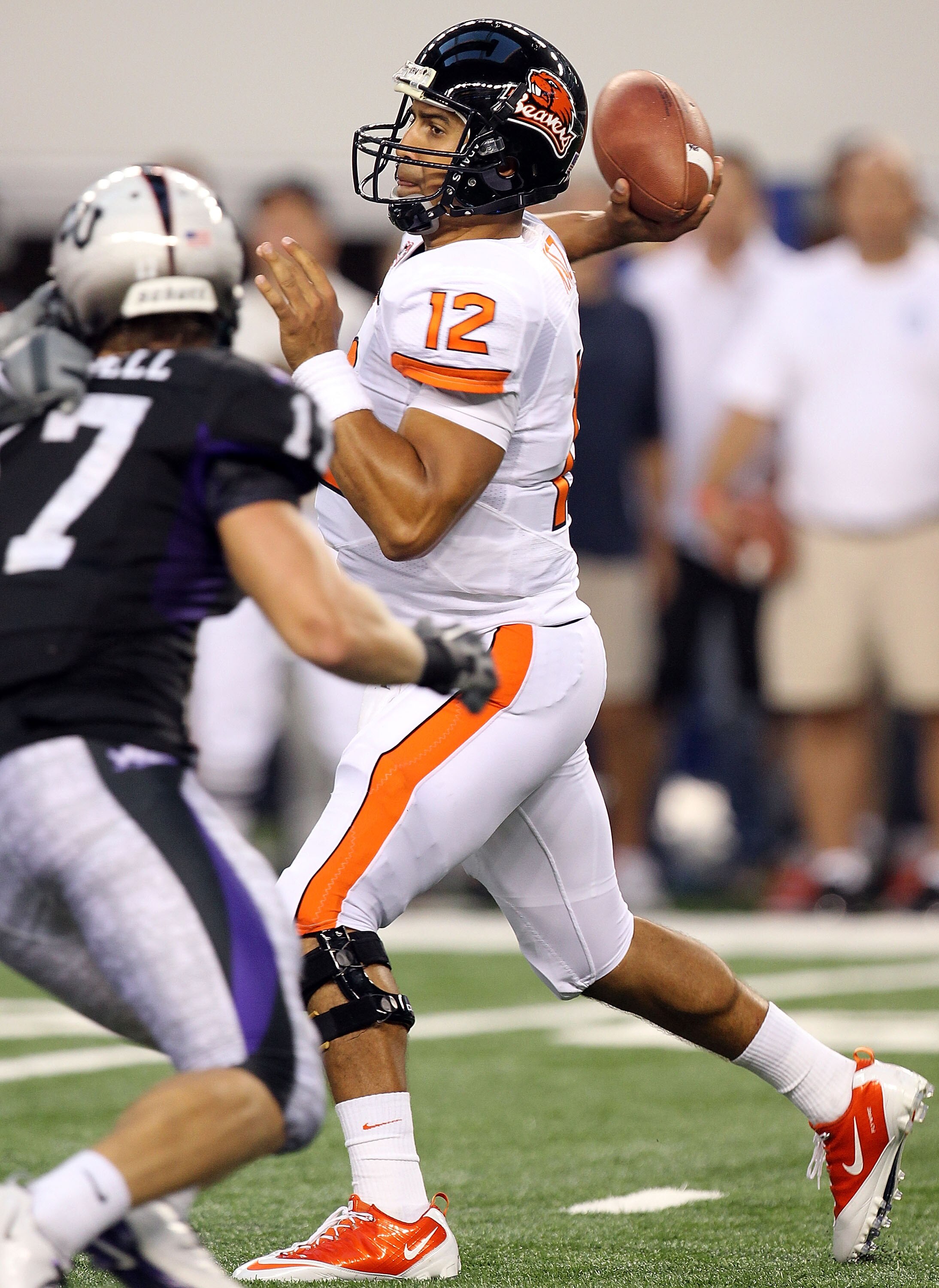 ARLINGTON, TX - SEPTEMBER 04:  Quarterback Ryan Katz #12 of the Oregon State Beavers drops back to pass against the TCU Horned Frogs at Cowboys Stadium on September 4, 2010 in Arlington, Texas.  (Photo by Ronald Martinez/Getty Images)