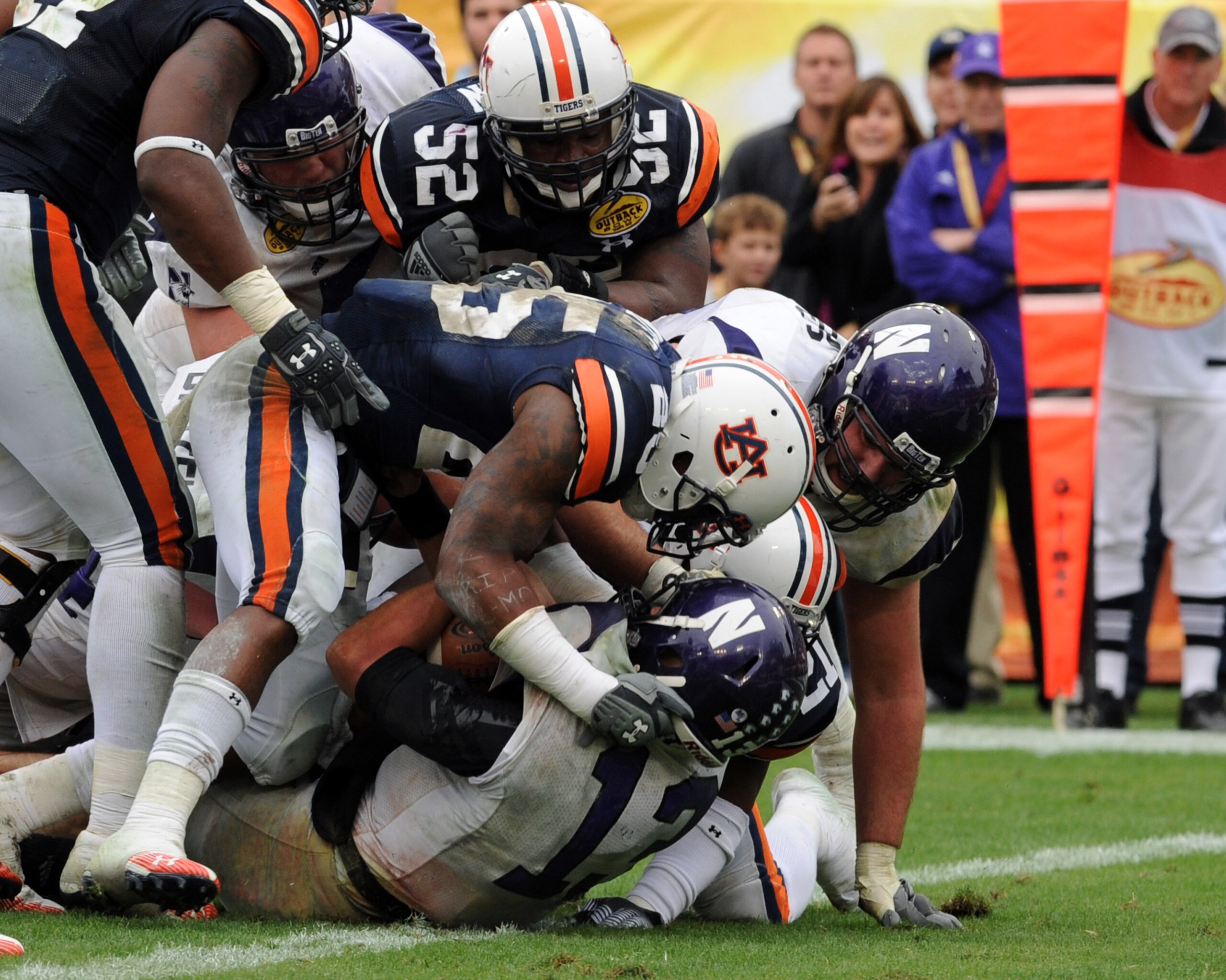 TAMPA, FL - JANUARY 1: Quarterback Mike Kafka #13 of the Northwestern Wildcats runs for a touchdown against the Auburn Tigers in the Outback Bowl January 1, 2010 at Raymond James Stadium in Tampa, Florida.  (Photo by Al Messerschmidt/Getty Images)