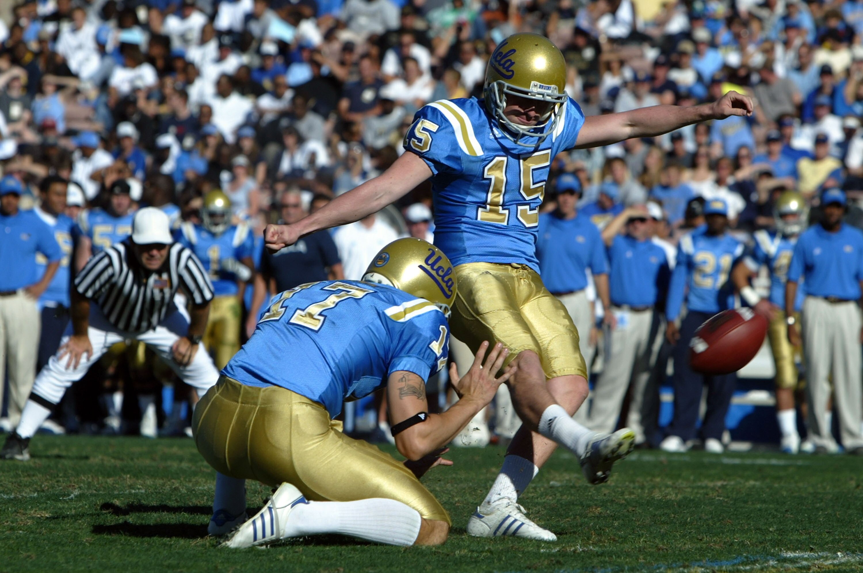 PASADENA, CA - NOVEMBER 24:  Place kicker Kai Forbath #15 of the UCLA Bruins kicks a field goal in the second quarter as Aaron Perez #19 holds against the Oregon Ducks at the Rose Bowl November 24, 2007 in Pasadena, California.  (Photo by Jeff Gross/Getty