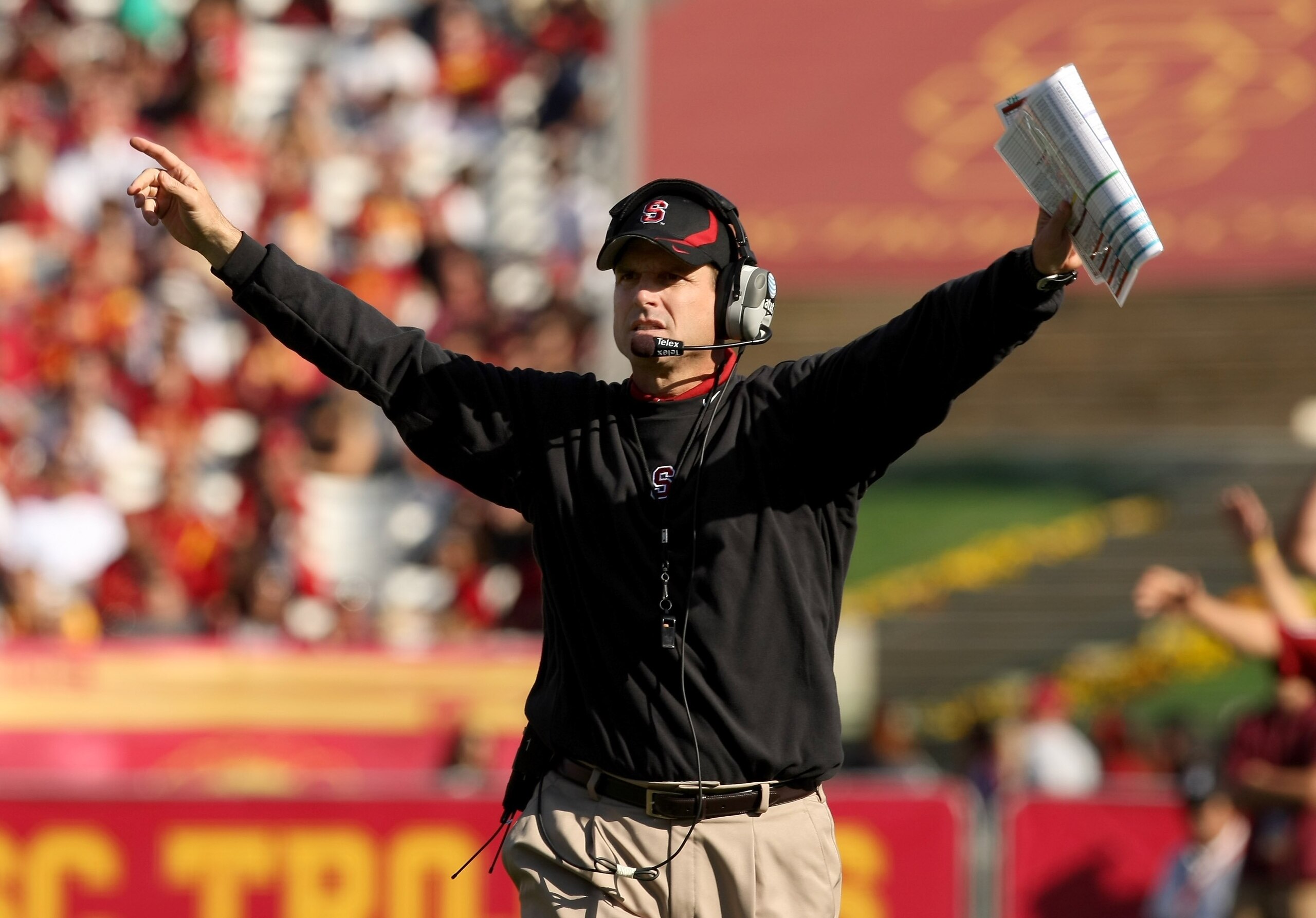 LOS ANGELES, CA - NOVEMBER 14:  Head coach Jim Harbaugh of the Stanford Cardinal signals during the game with the USC Trojans on November 14, 2009 at the Los Angeles Coliseum in Los Angeles, California.  Stanford won 55-21.  (Photo by Stephen Dunn/Getty I