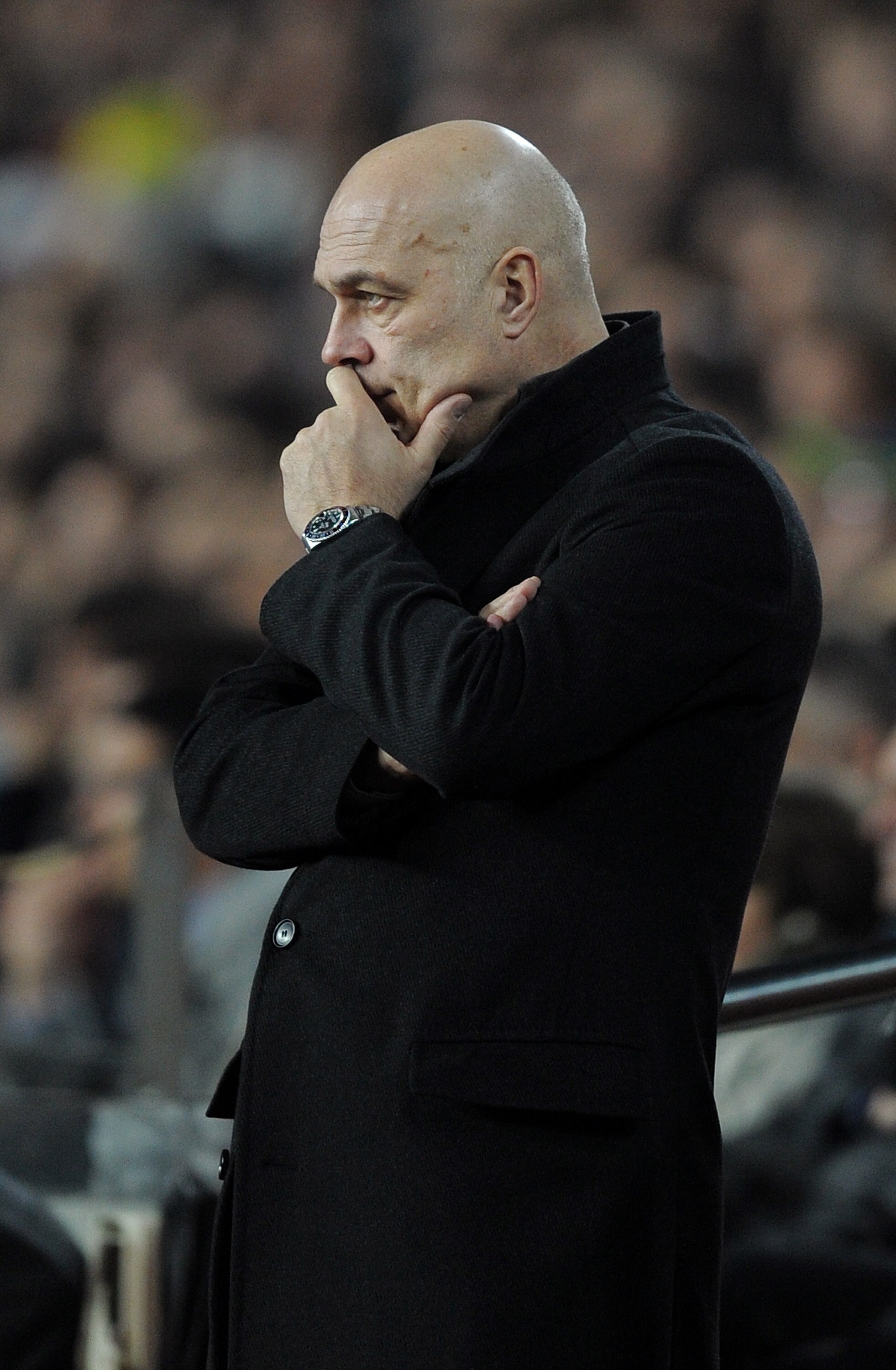 BARCELONA, SPAIN - MARCH 17:  Head coach Christian Gross of Stuttgart looks pensive as he follows his players during the UEFA Champions League round of sixteen second leg match between FC Barcelona and VfB Stuttgart at the Camp Nou stadium on March 17, 20