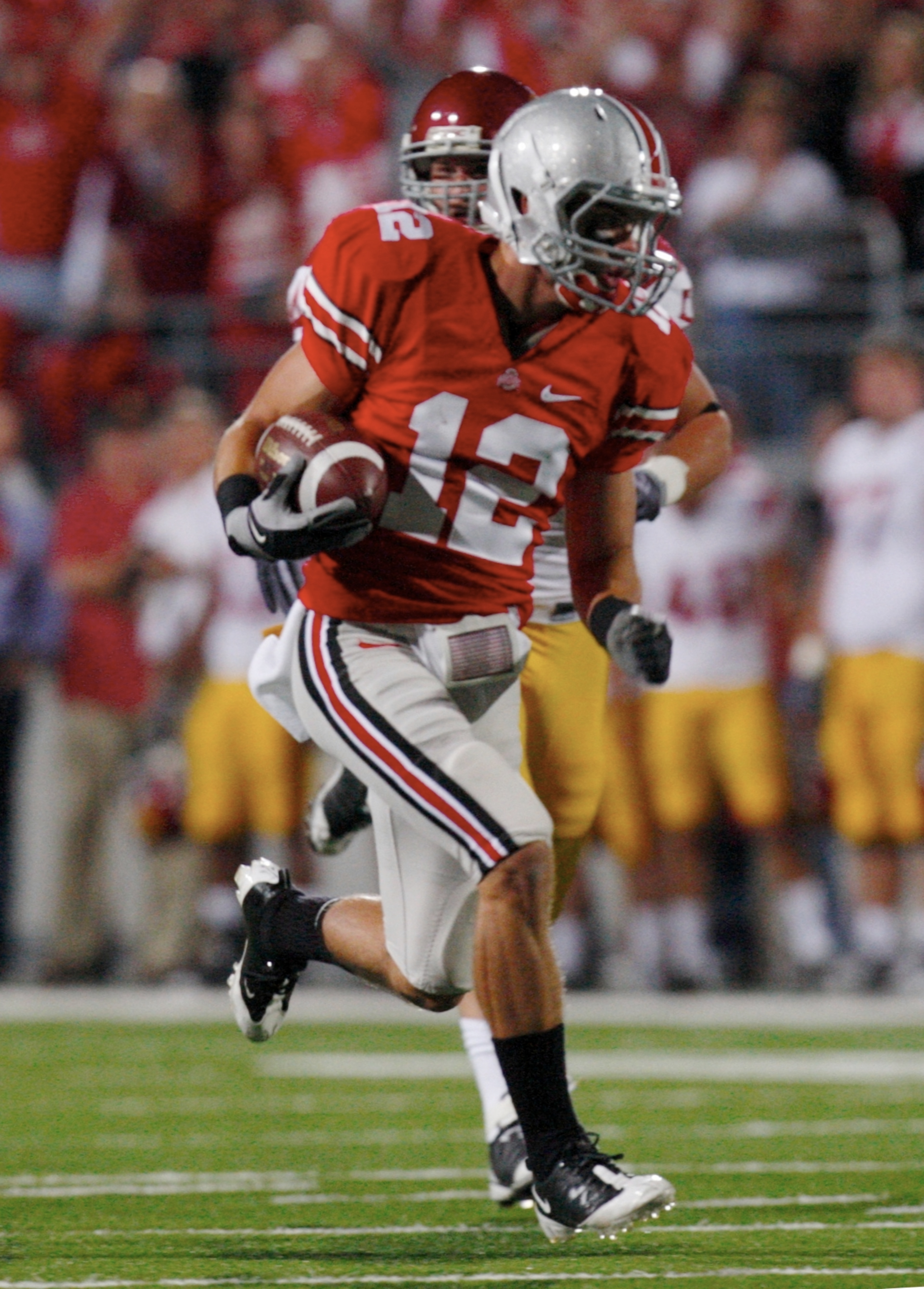 COLUMBUS, OH - SEPTEMBER 12: Jake Stoneburner #12 of the Ohio State Buckeyes carries the ball on a 56-yard run against the USC Trojans during the game at Ohio Stadium on September 12, 2009 in Columbus, Ohio. (Photo by Gregory Shamus/Getty Images) COLUMBUS, OH - SEPTEMBER 12: Jake Stoneburner #12 of the Ohio State Buckeyes carries the ball on a 56-yard run against the USC Trojans during the game at Ohio Stadium on September 12, 2009 in Columbus, Ohio. (Photo by Gregory Shamus/Getty Images)
